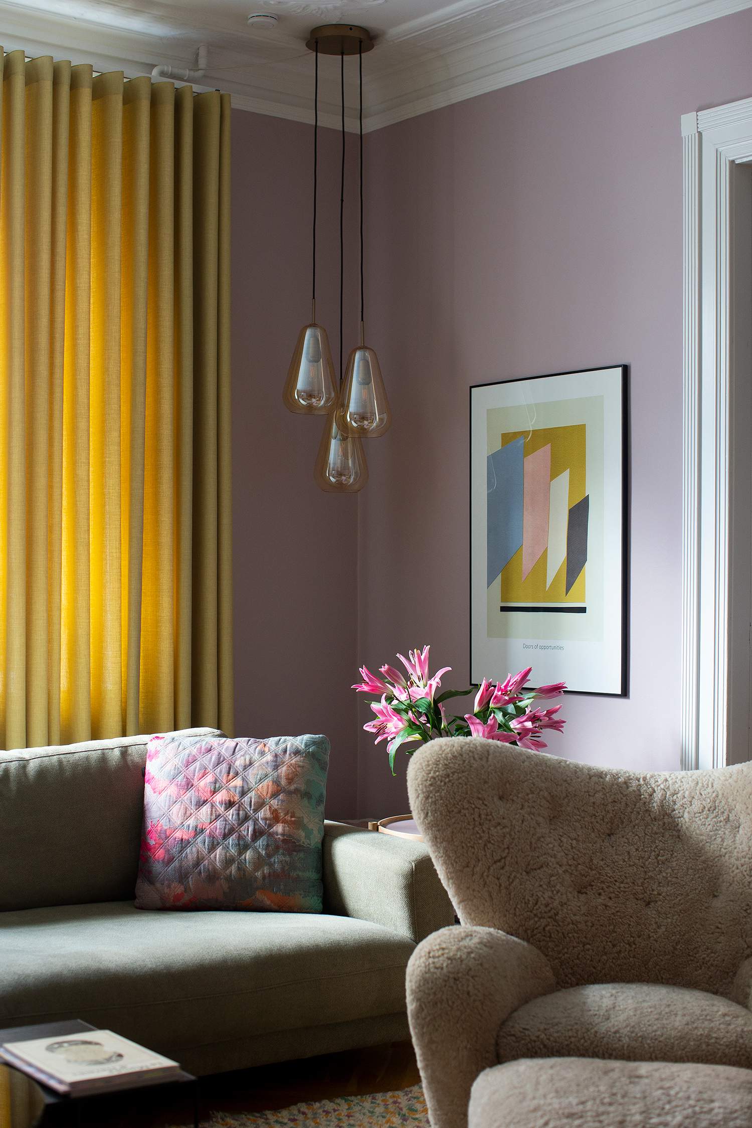 Yellow curtains in a purple living room 