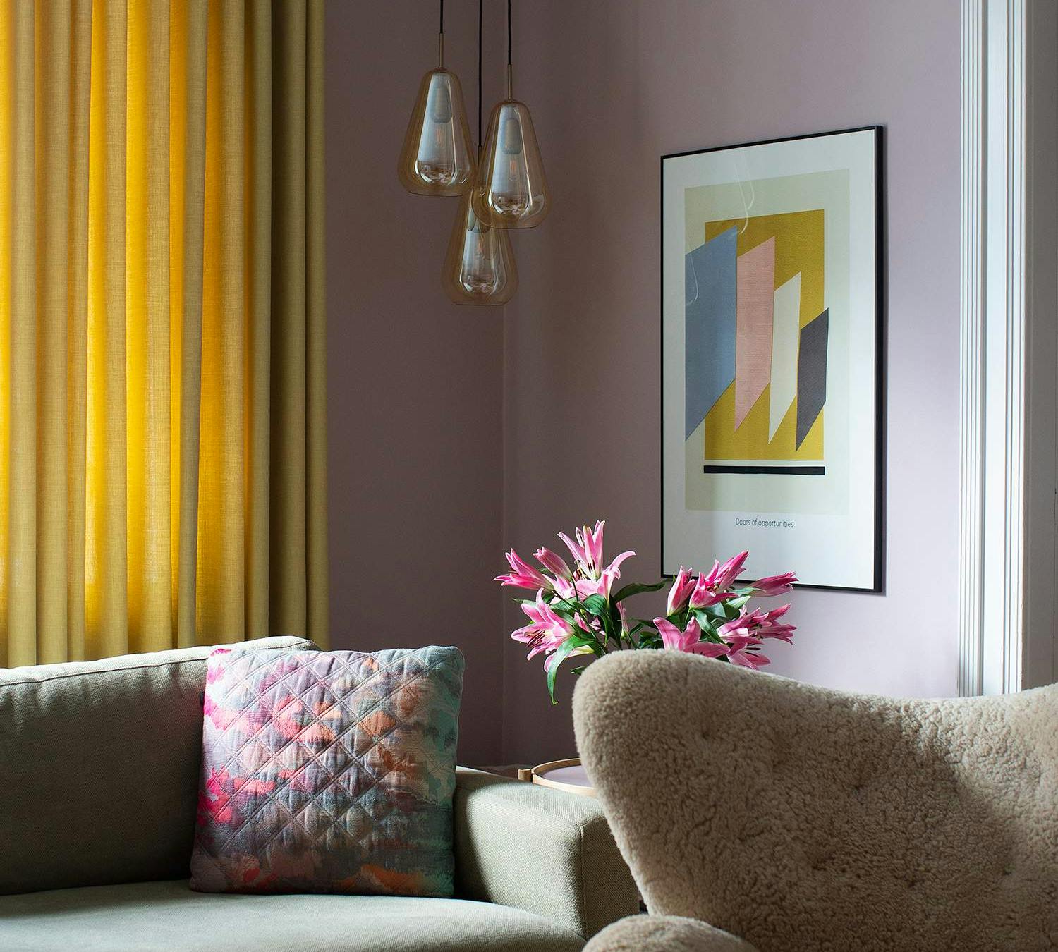Yellow curtains in a purple living room