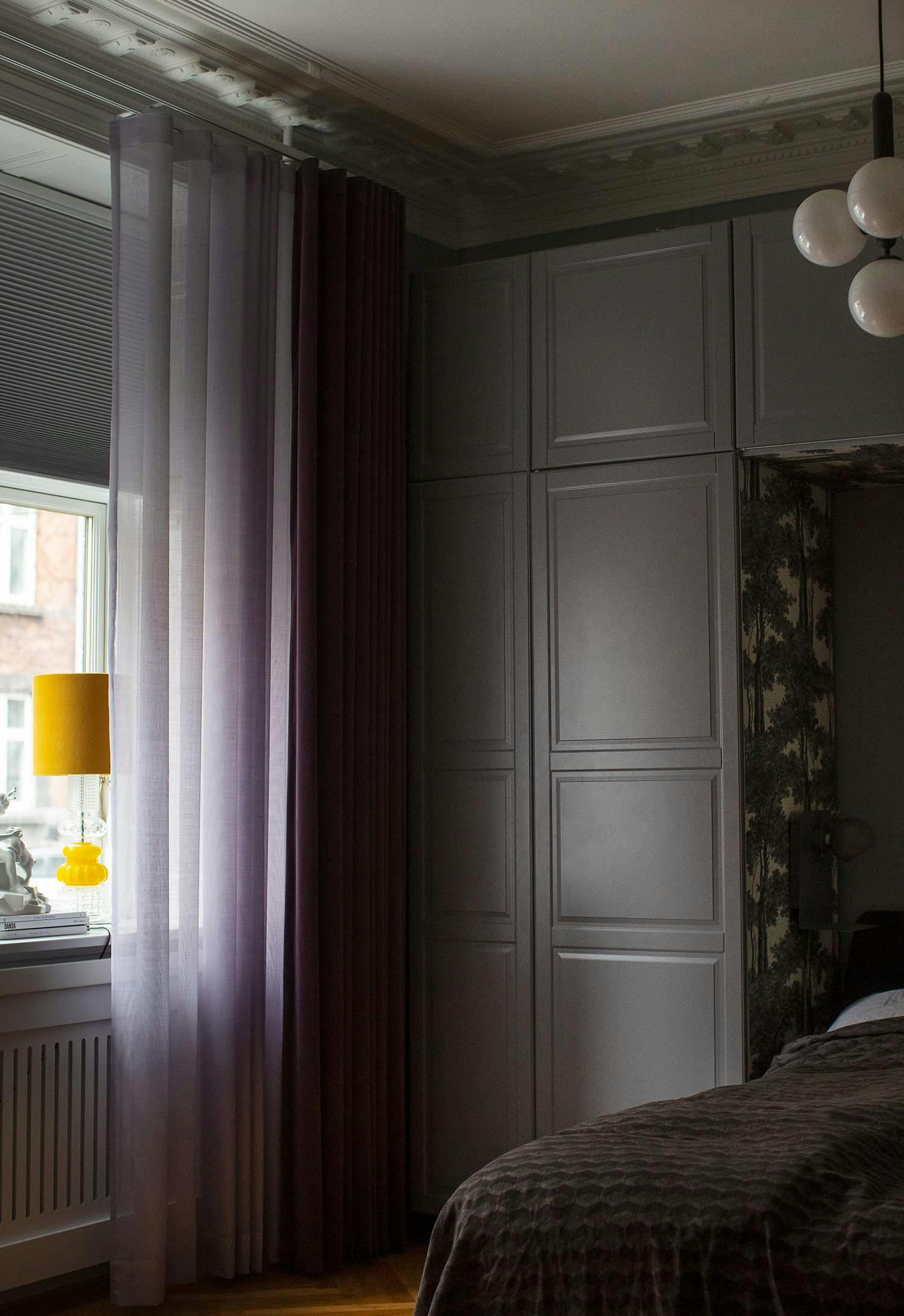 Purple curtains in a bedroom 