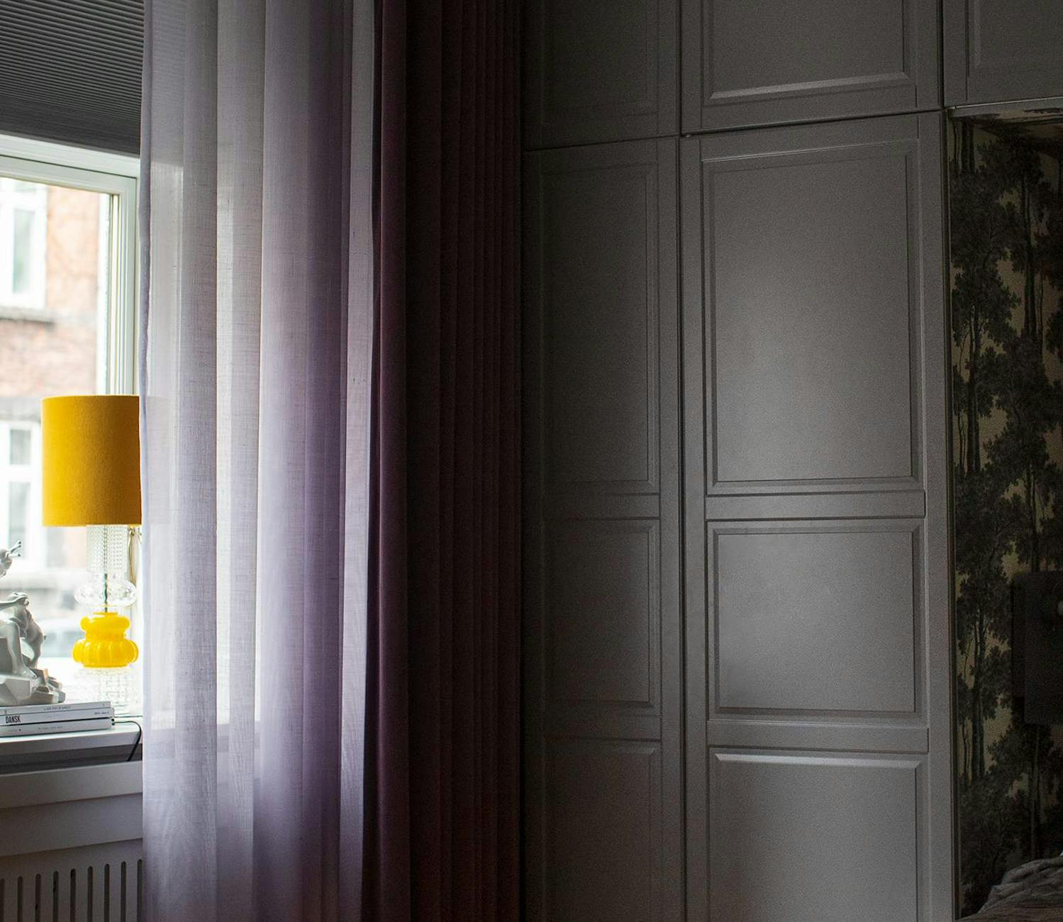 Purple curtains in a bedroom