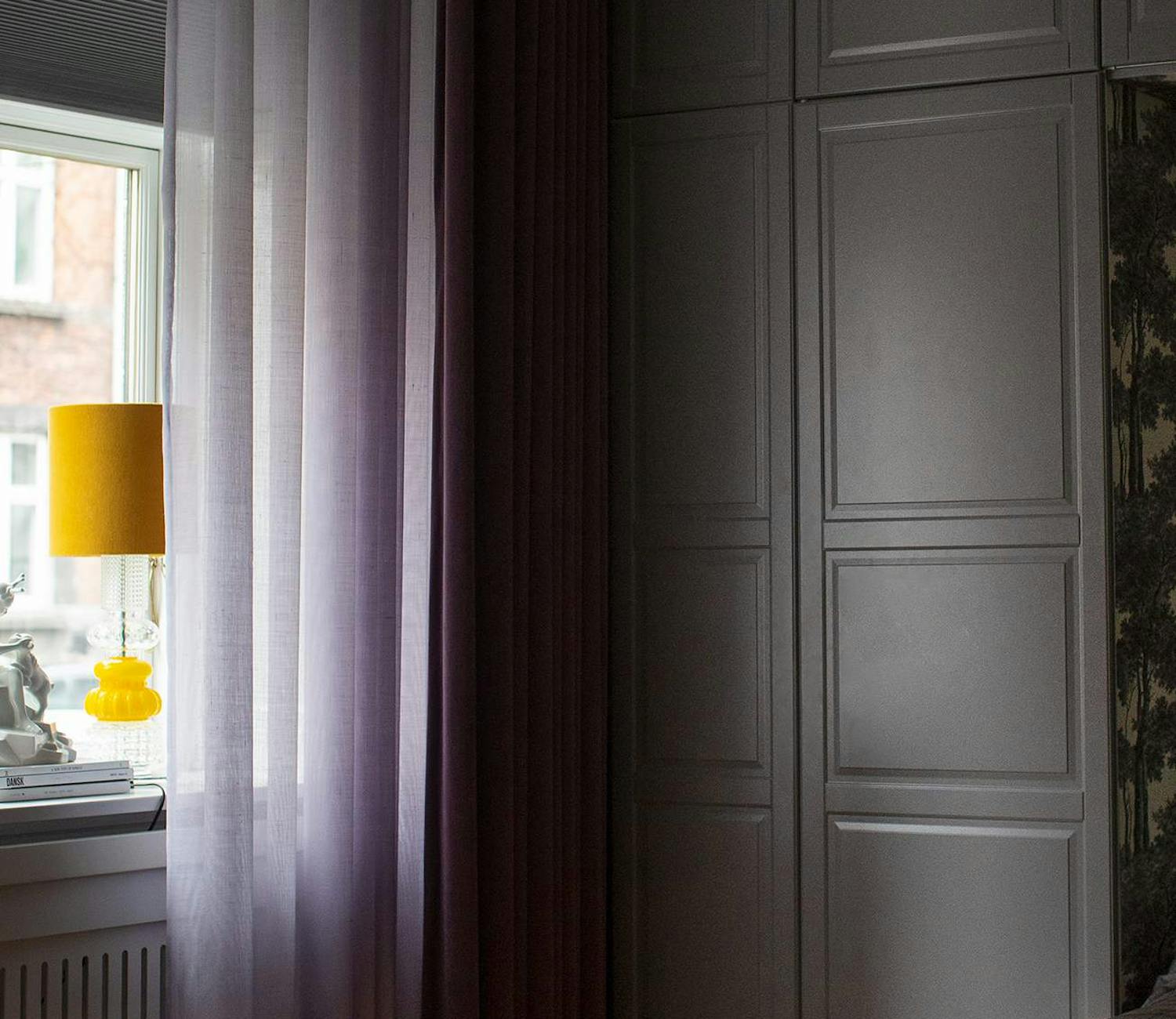 Purple curtains in a bedroom