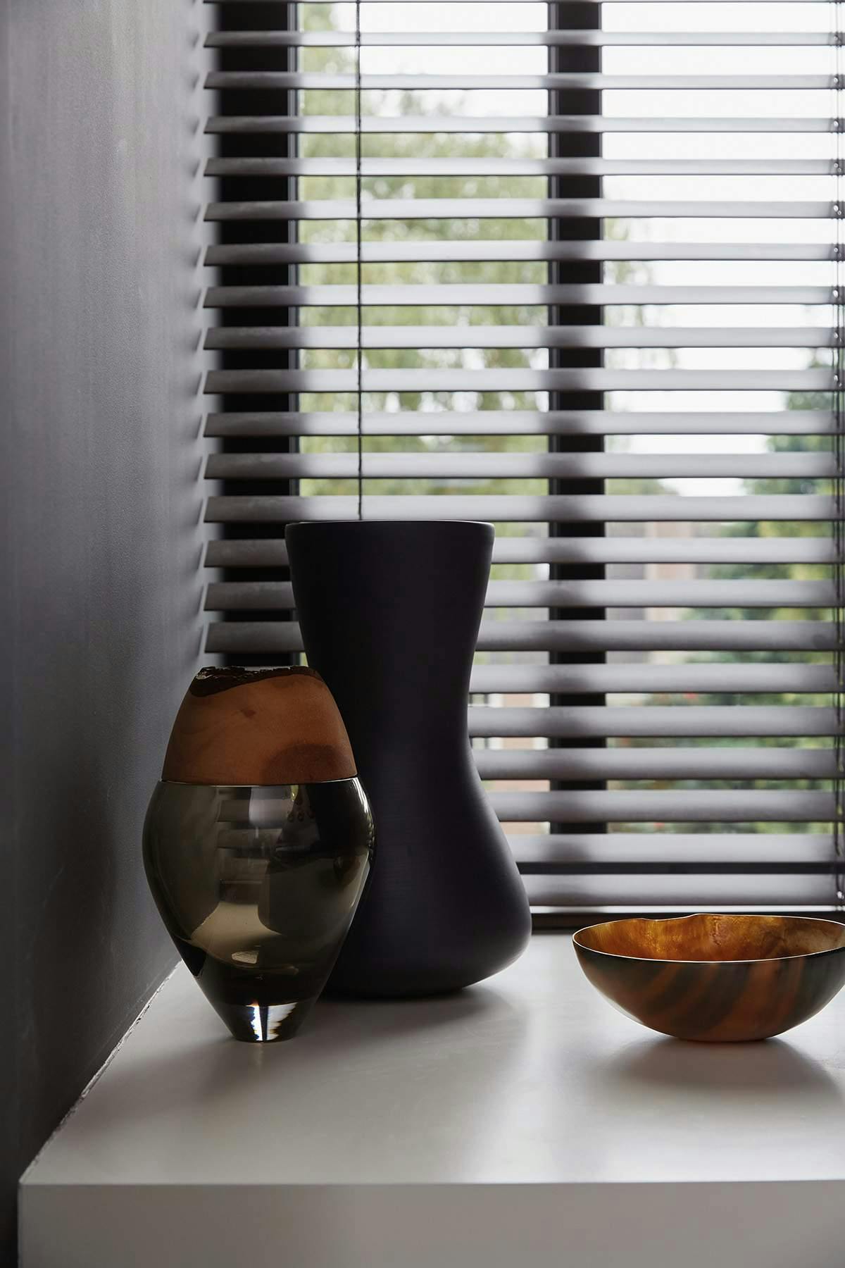 Closeup of black wood blinds 