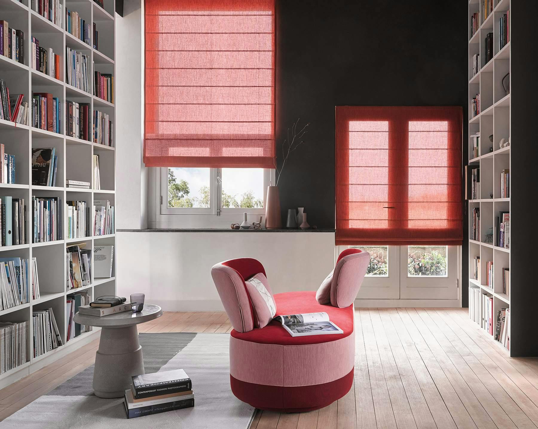 Red roman shades in a living room 
