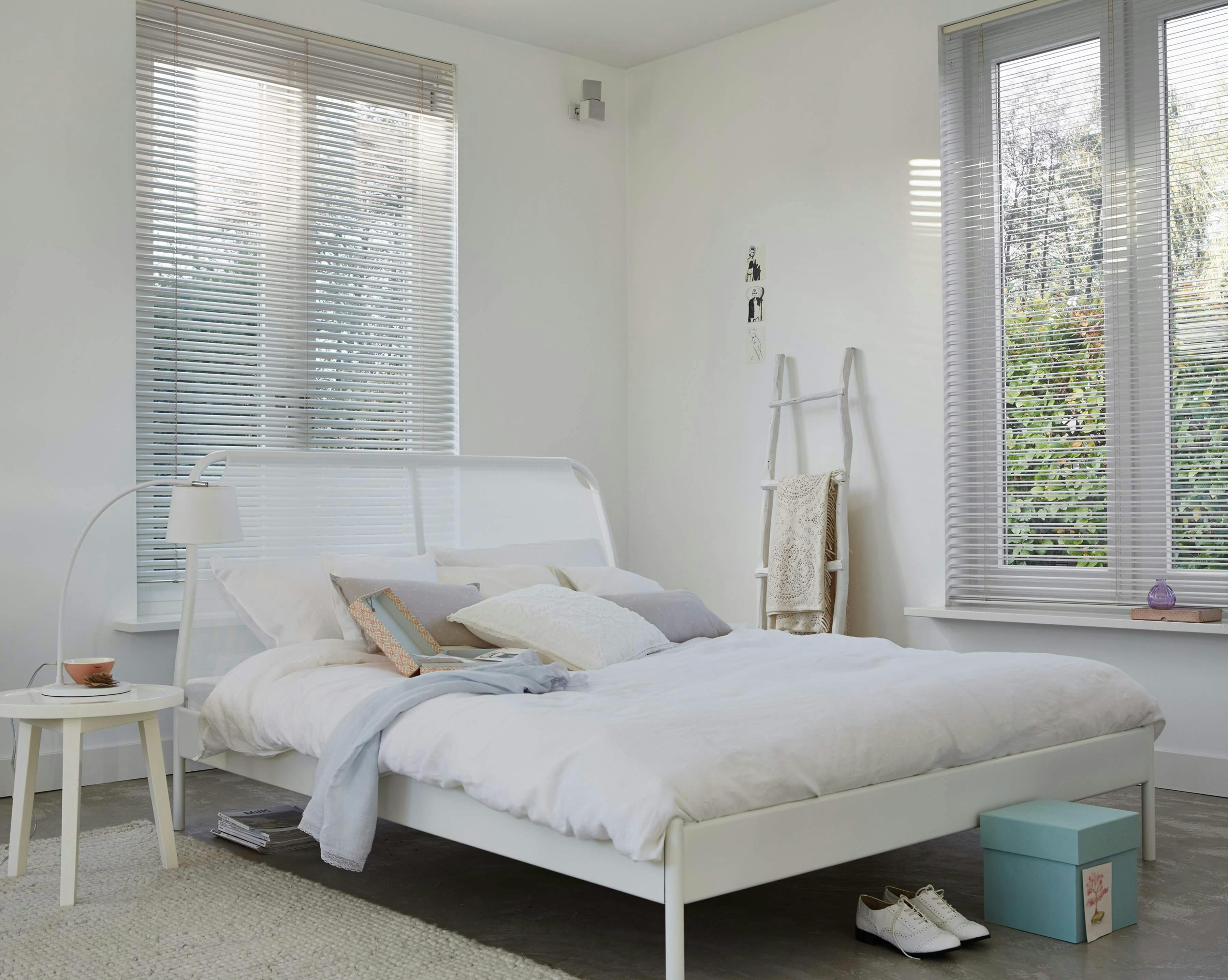 White venetian blinds in a bedroom