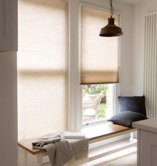 Cream duette shades in a living room