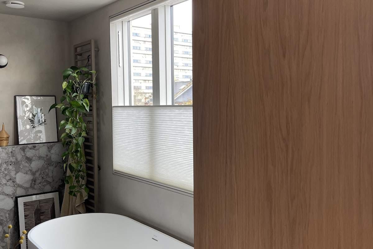 White duette shades on a bathroom