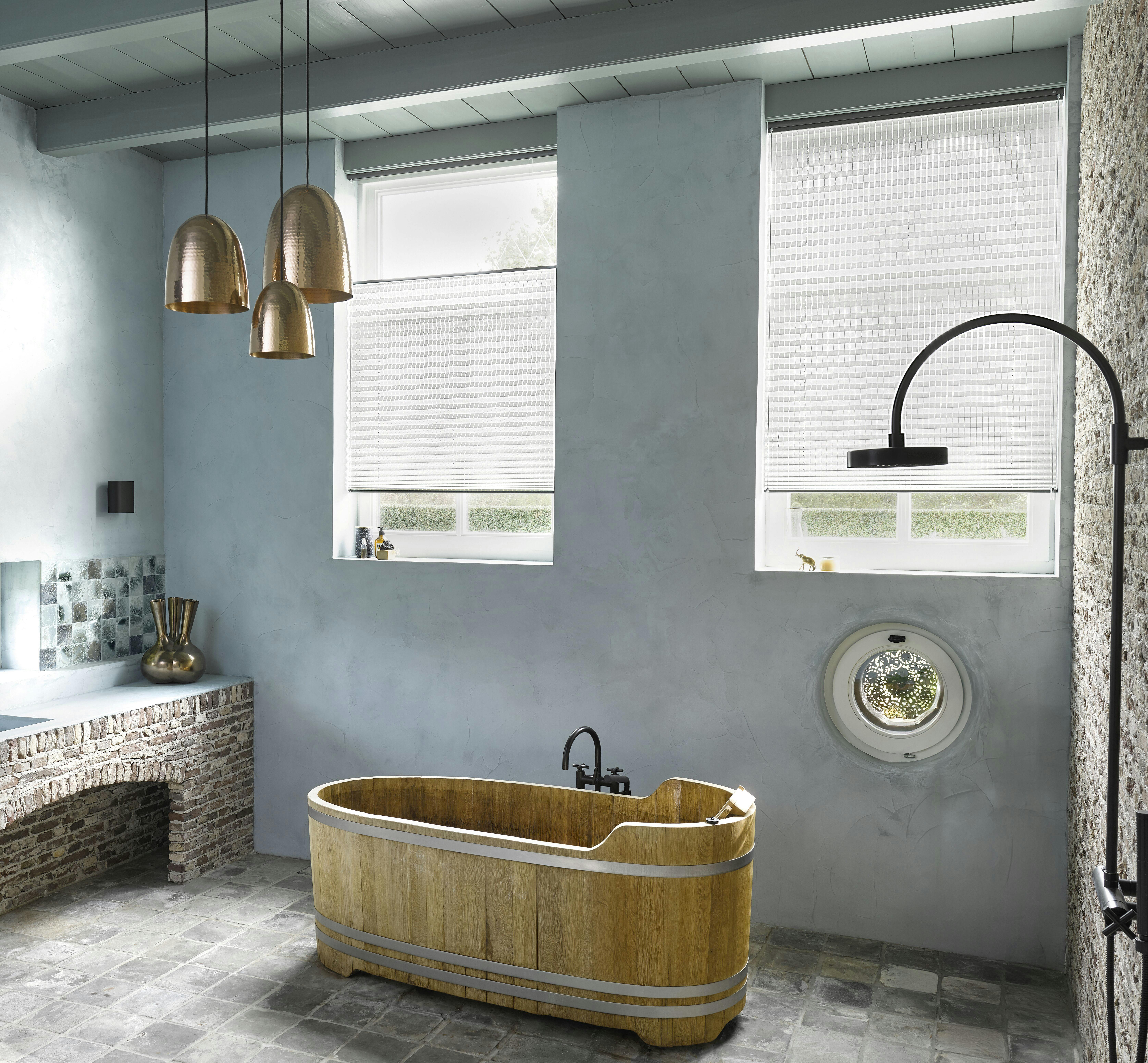 White plisse shades in a blue bathroom 