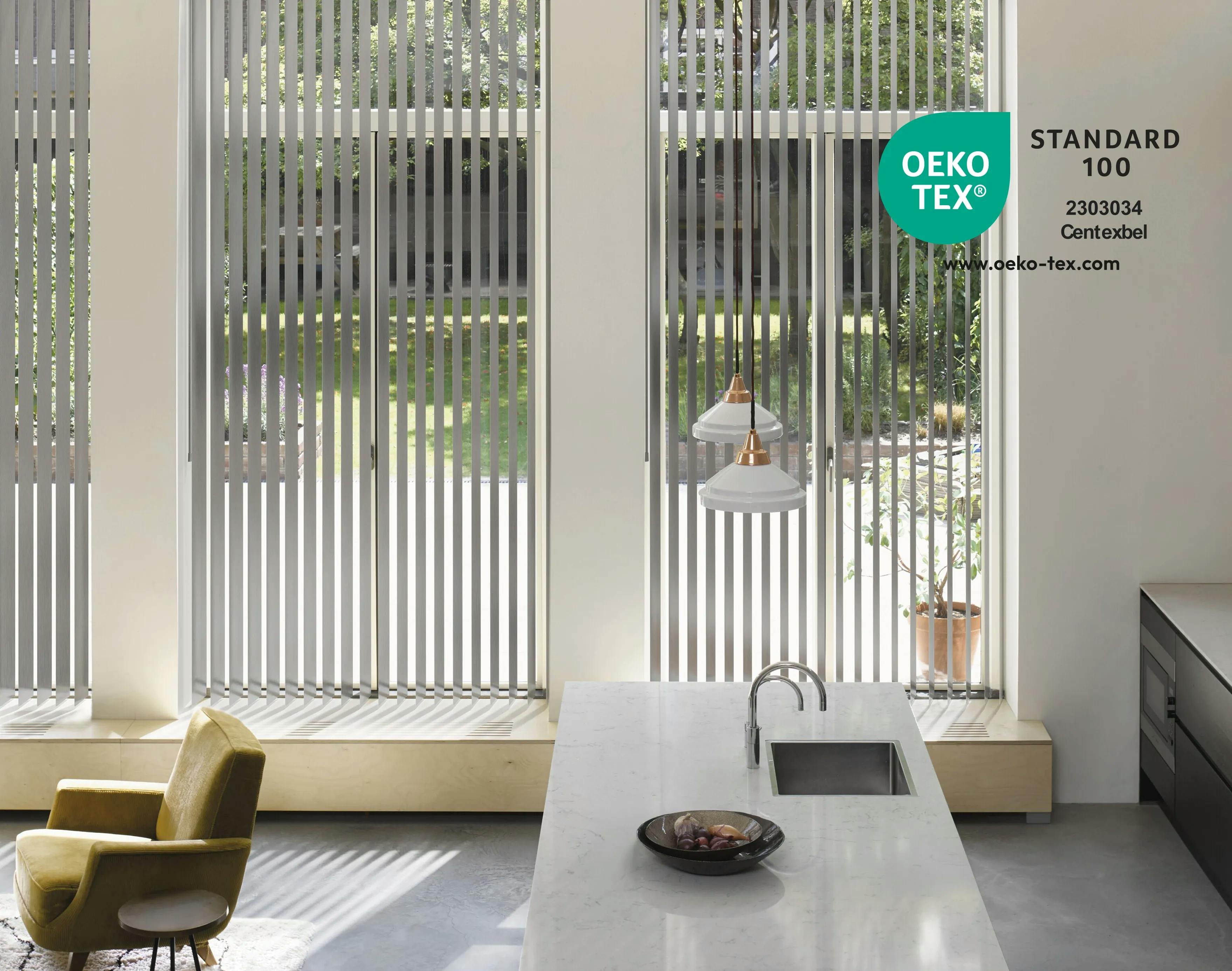 Grey vertical blinds on large windows in a spacious kitchen and dining room area
