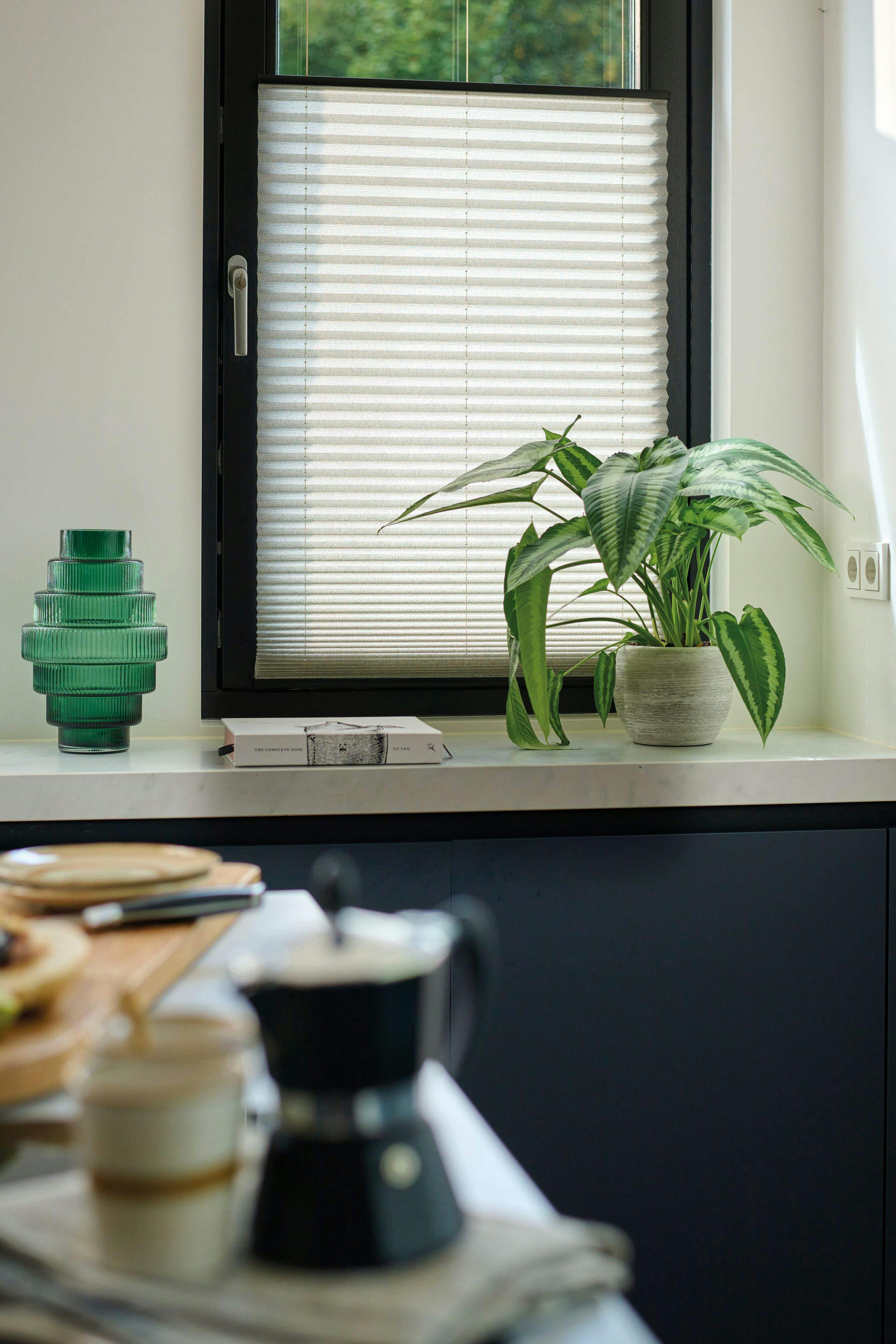 White blind covering kitchen window