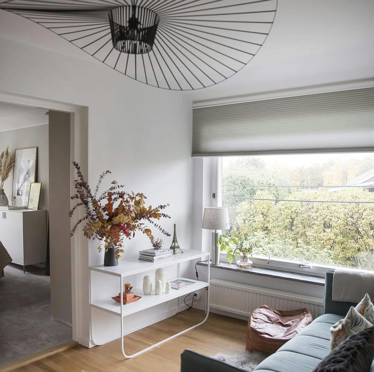 Duette blind covering large living room window