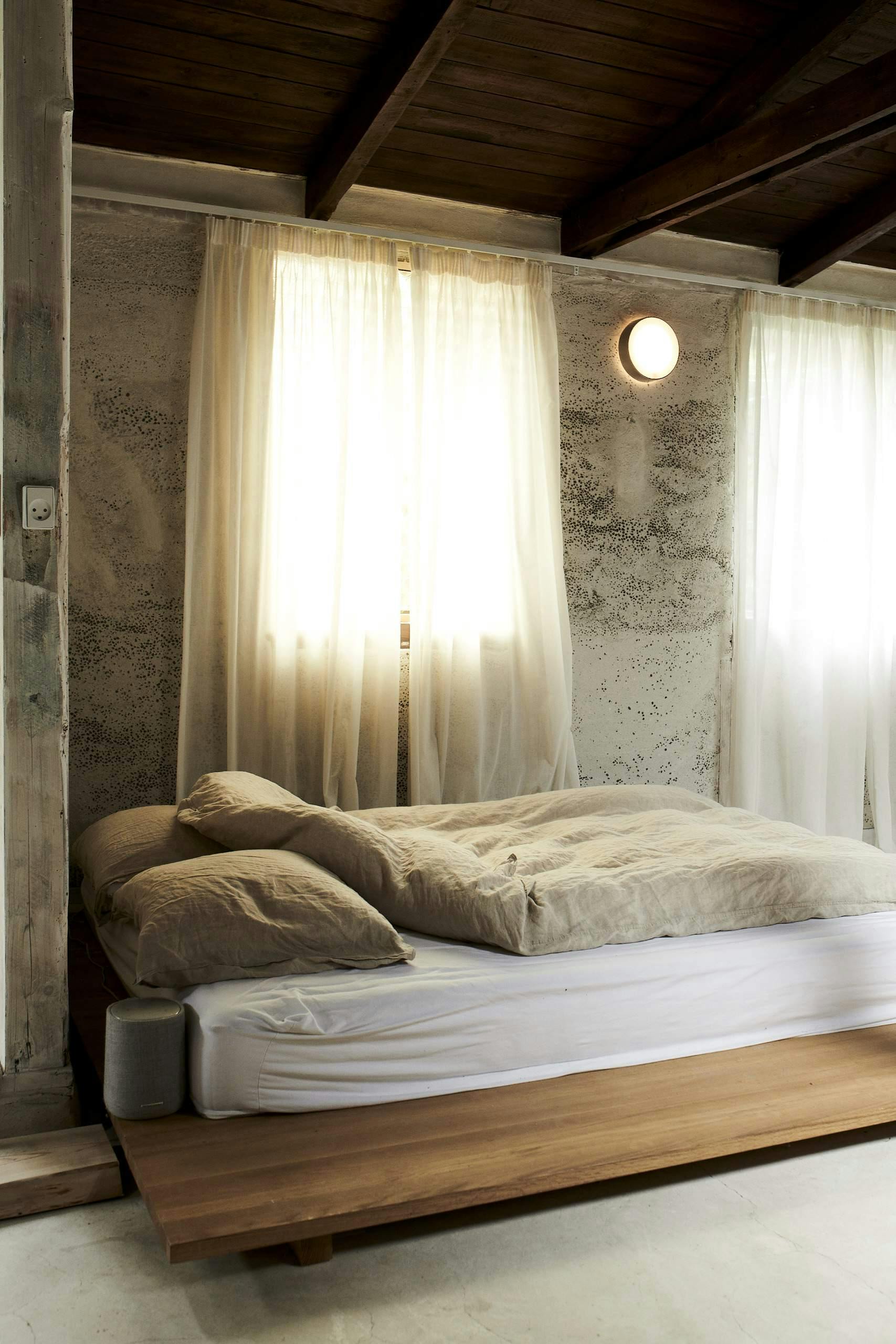 white curtains providing privacy and light over bedroom windows
