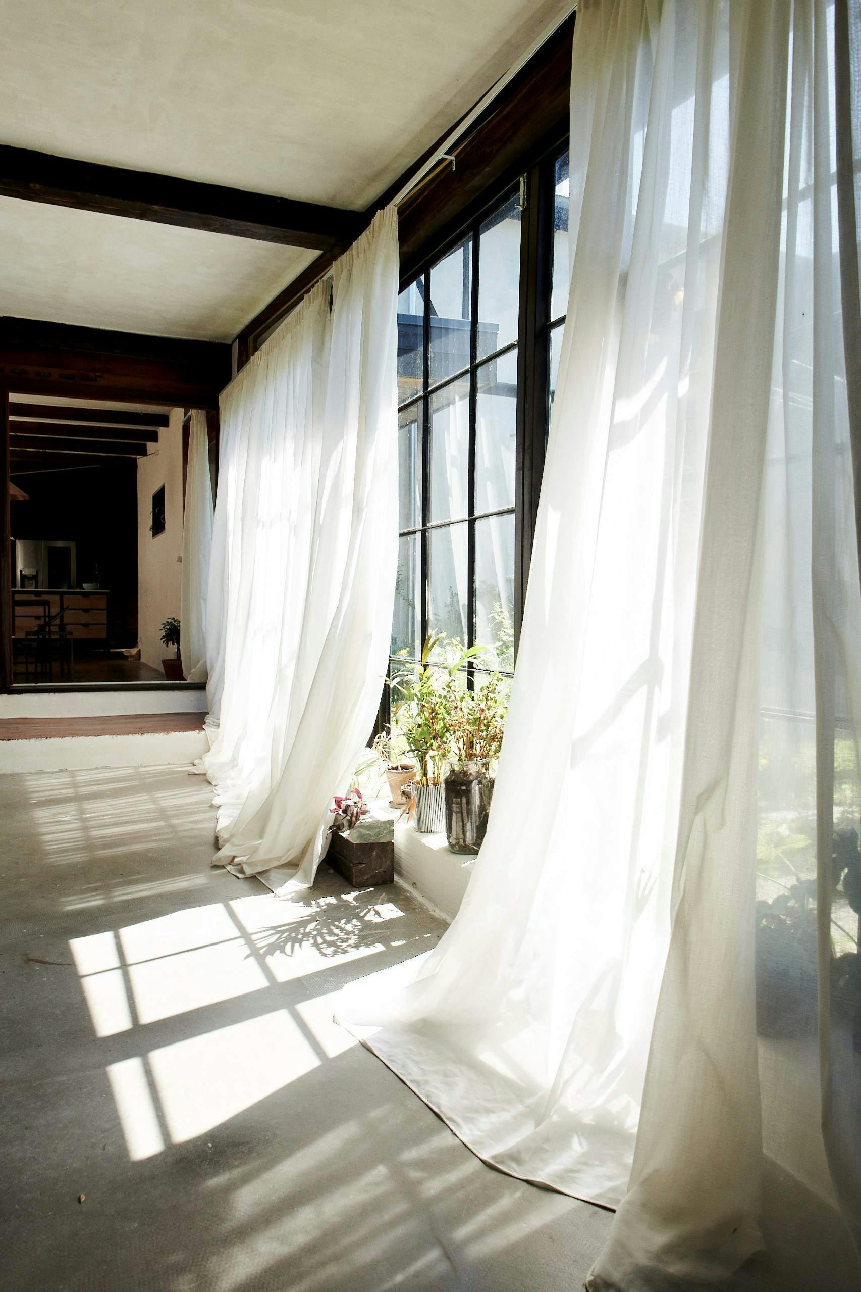 sheer curtains over large windows