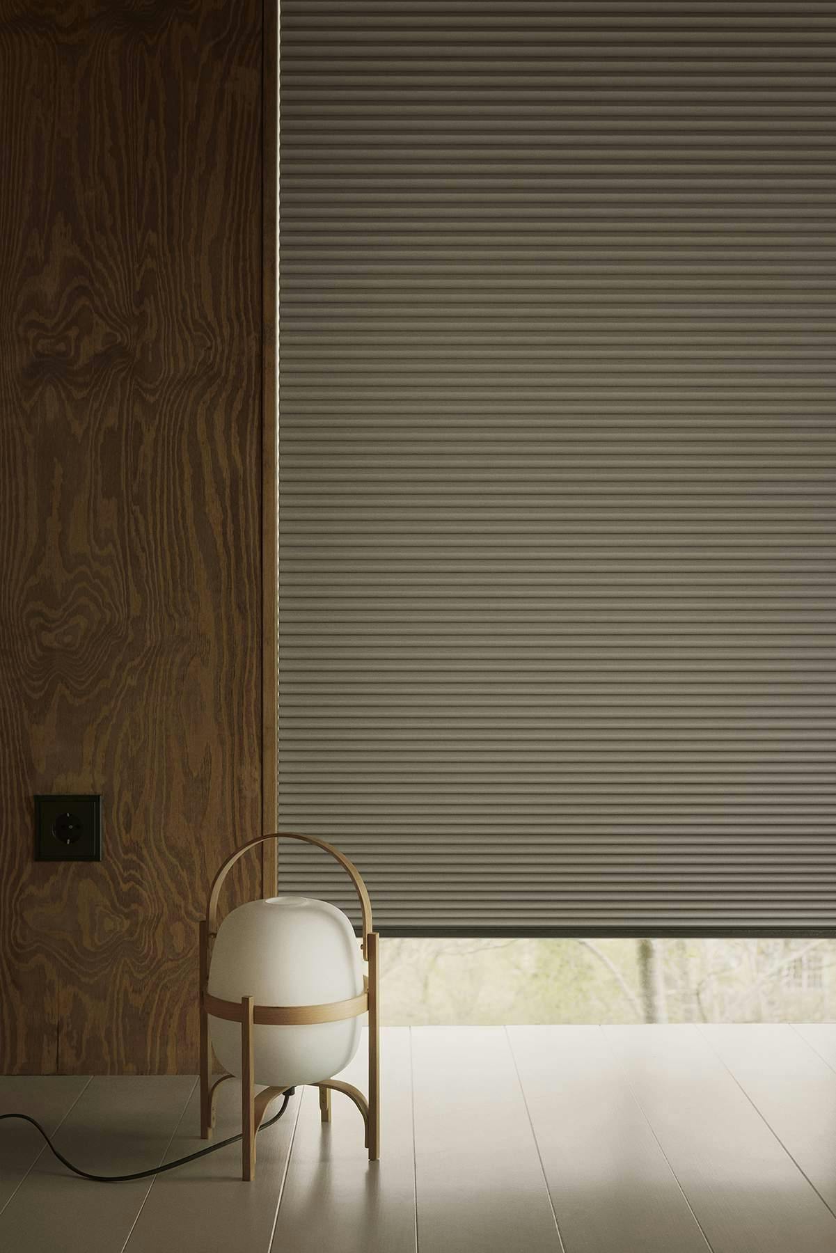 Duette powerview blinds covering floor to ceiling windows