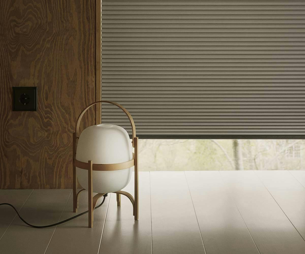 Duette powerview blinds covering floor to ceiling windows