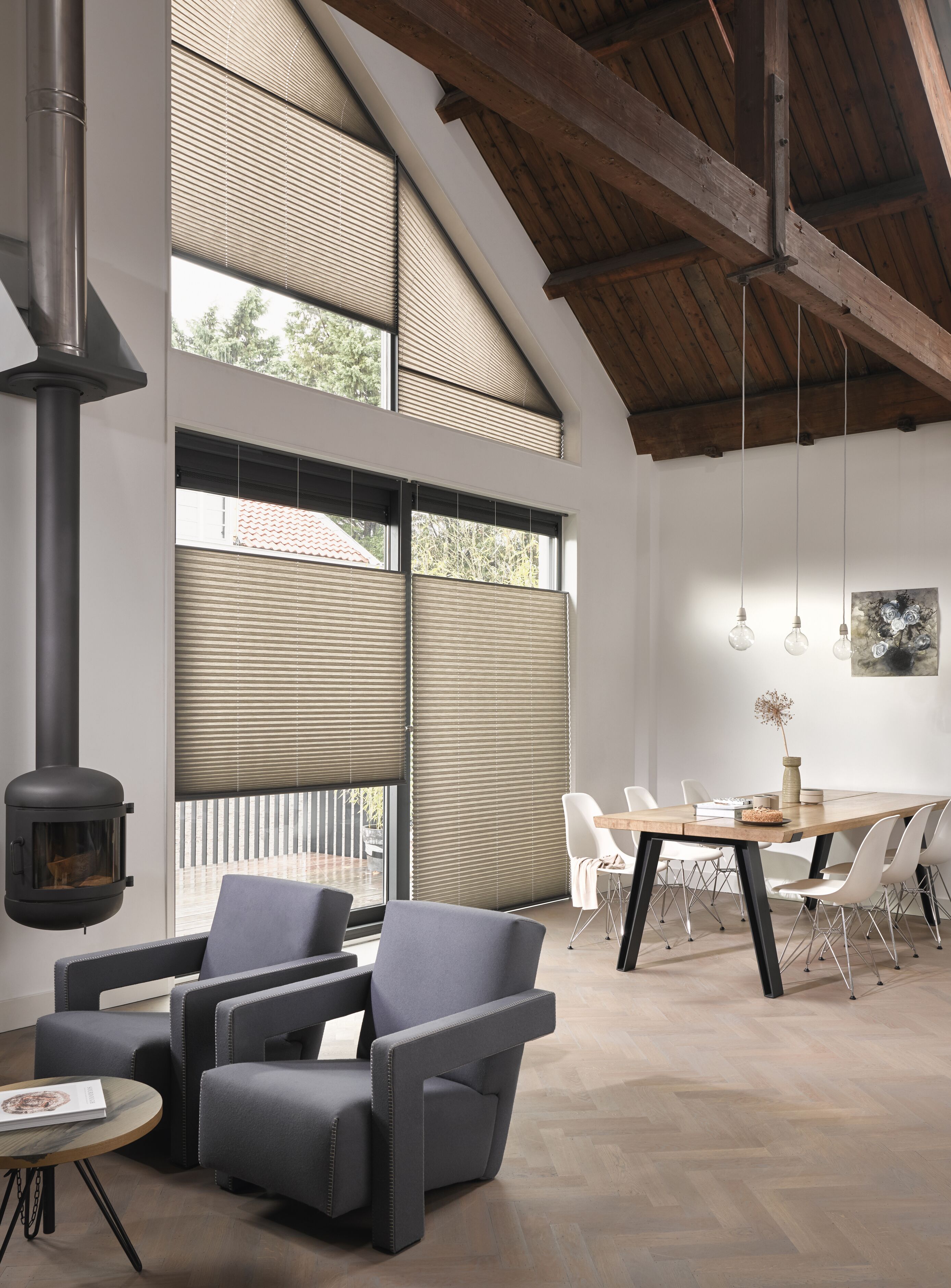 Beige Plisse blinds in shaped windows in a living room