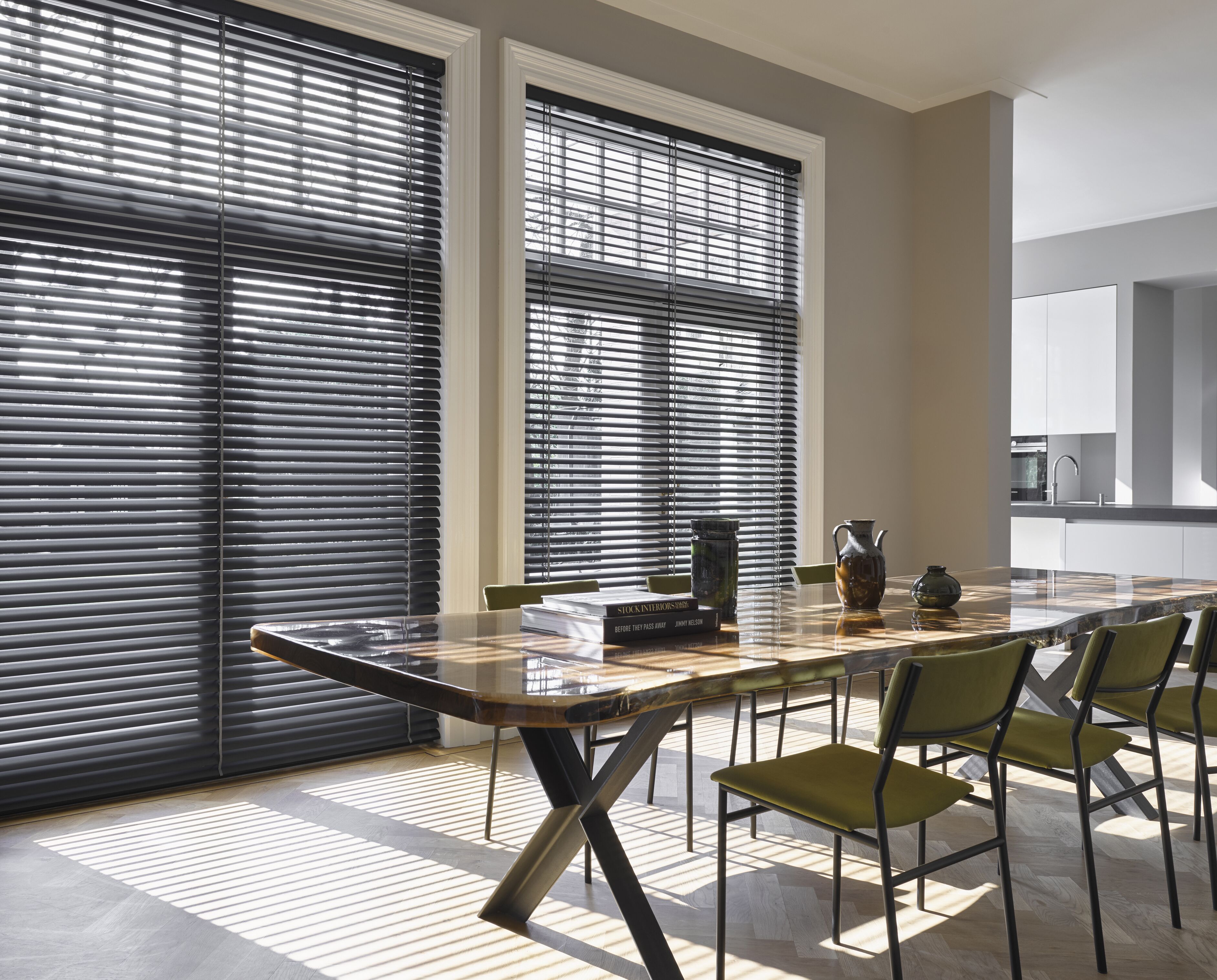 Black venetian blinds in full height kitchen dining room windows