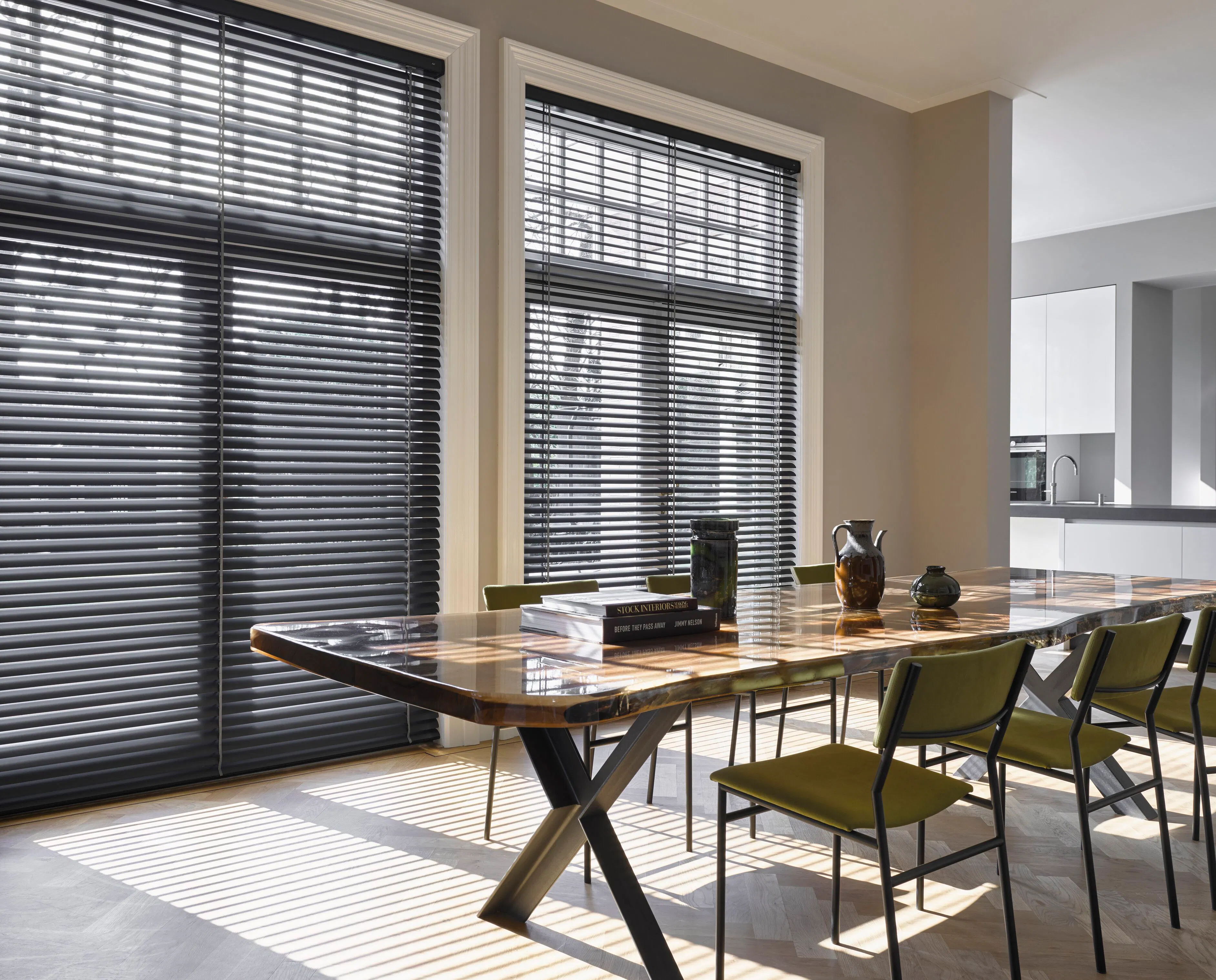 Black venetian blinds in full height kitchen dining room windows