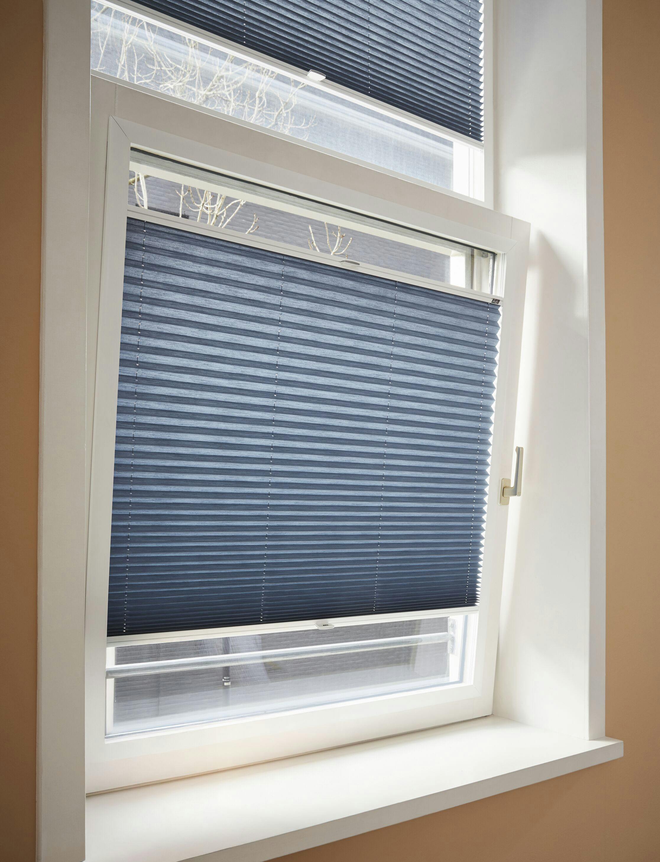 Tilt and turn window with blue Plissé shades