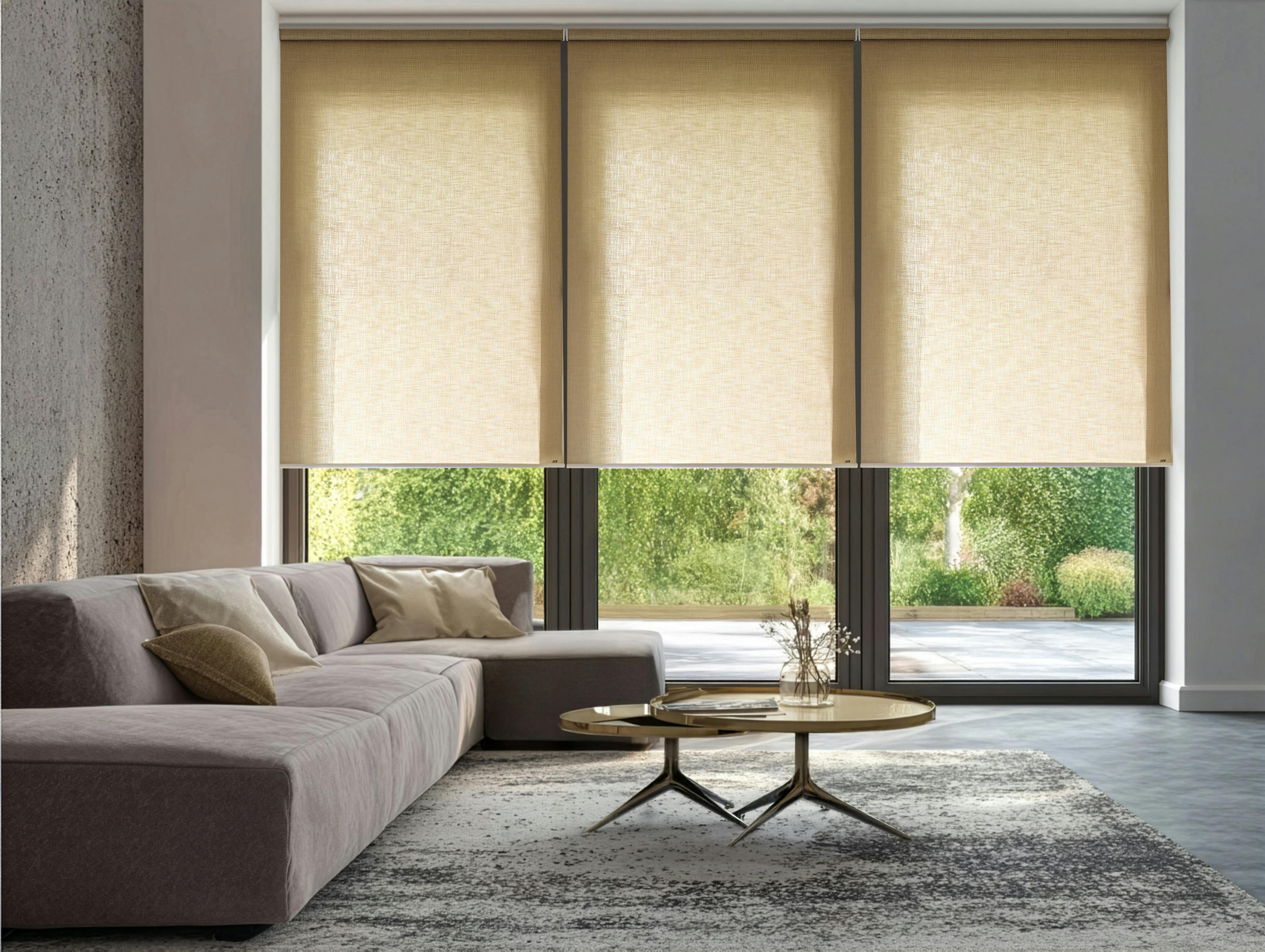Light yellow roller blinds on bi-fold doors in a modern living room