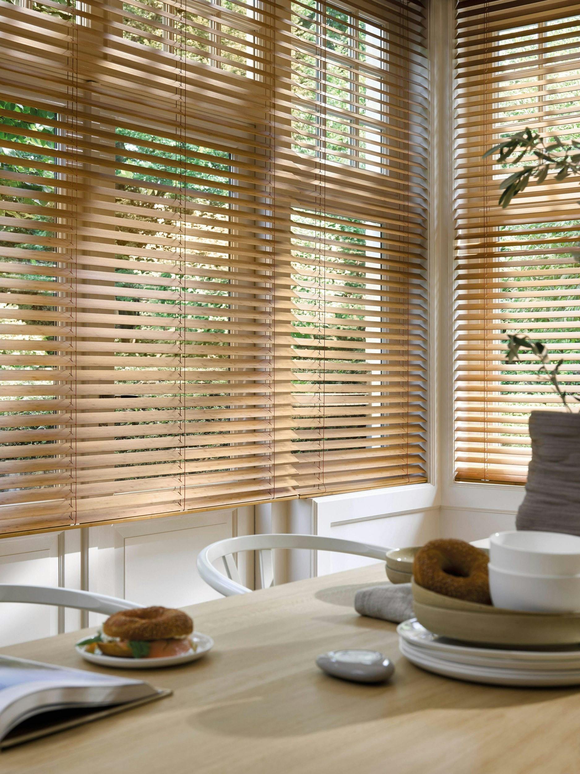 Dining room with wood venetian blinds 