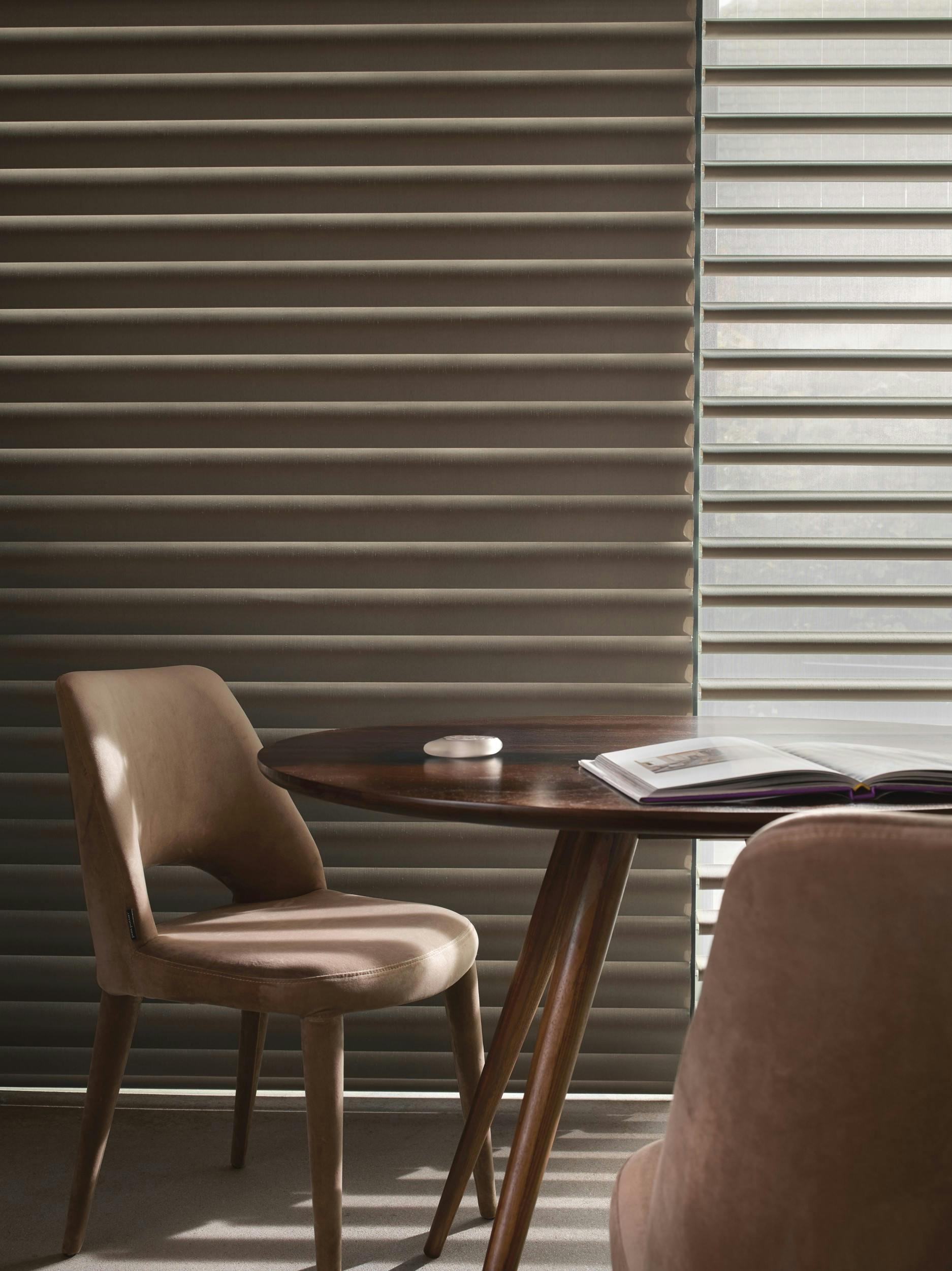Brown Pirouette® blinds in an open and closed position