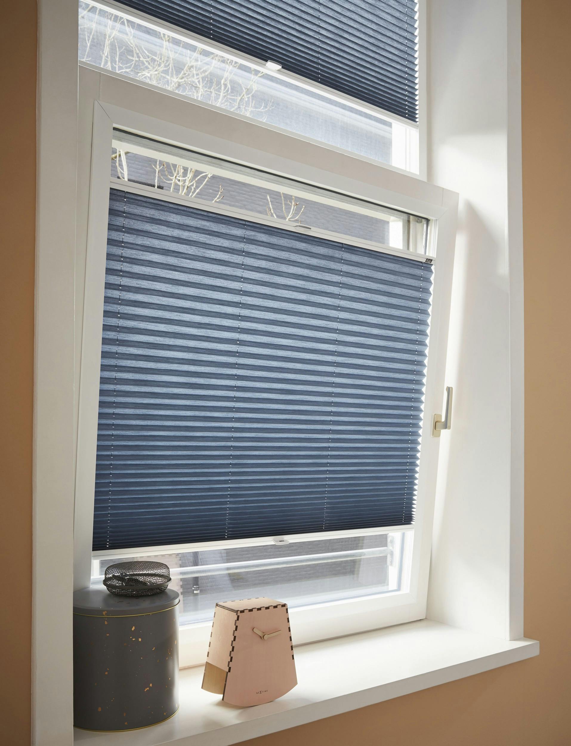 Tilt and turn window with blue plissé shades