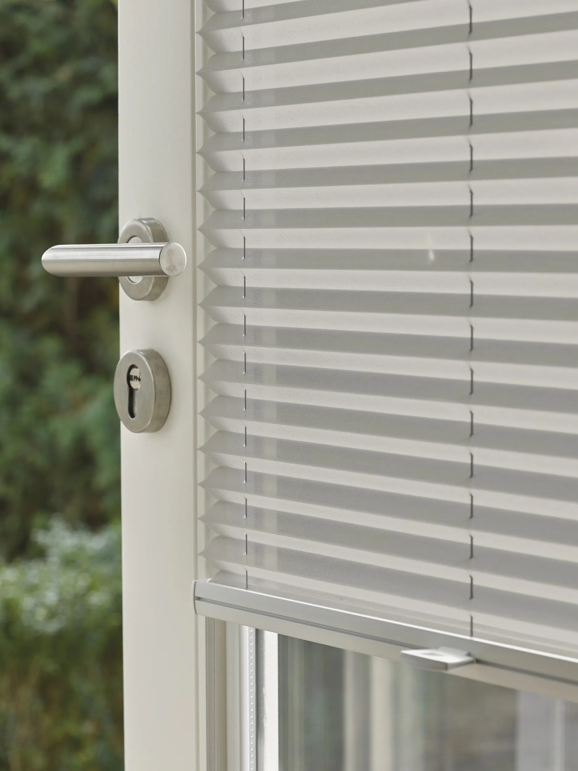 Patio door with grey plisse shades fitted with Trufit