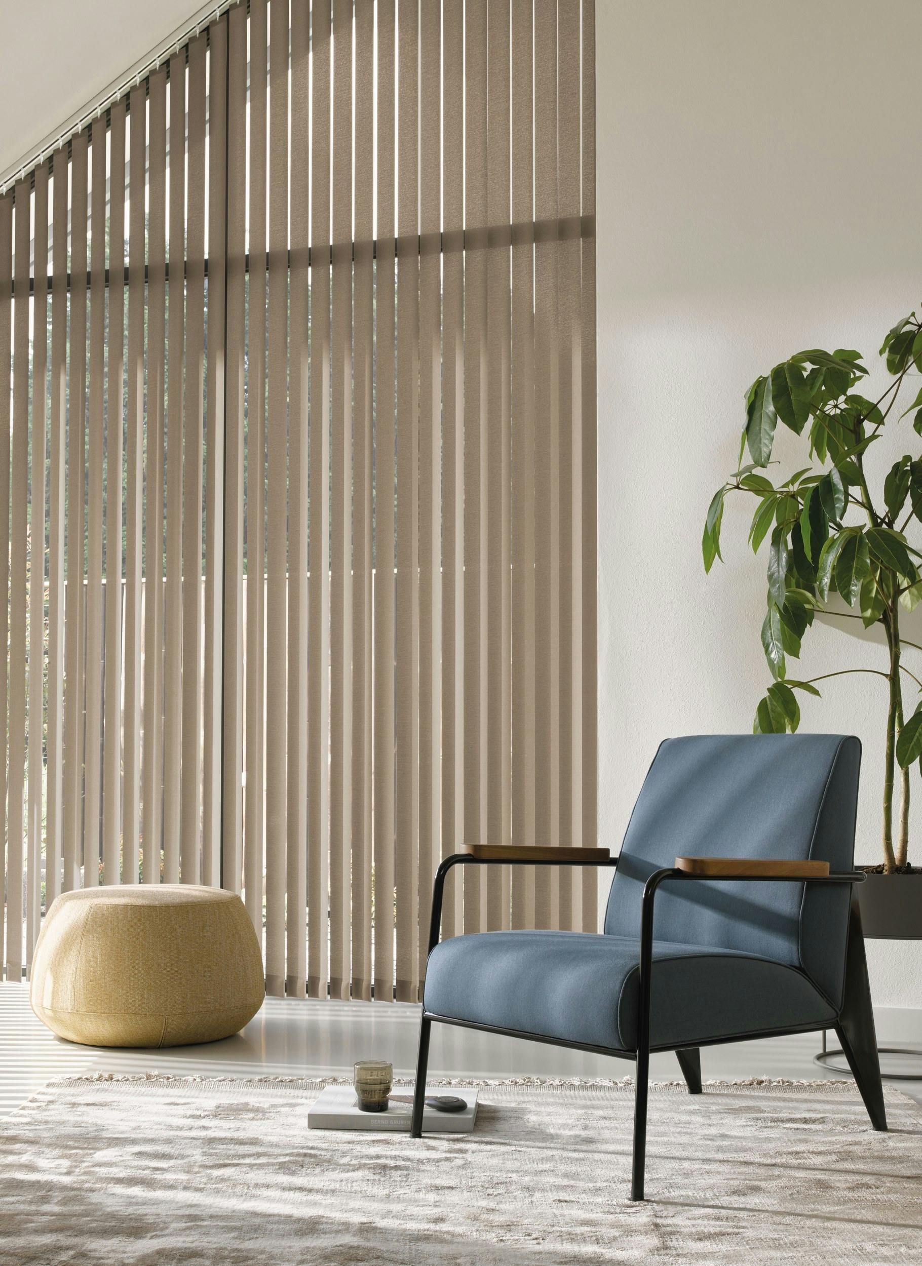 Brown vertical blinds on a special window shape in a living room  