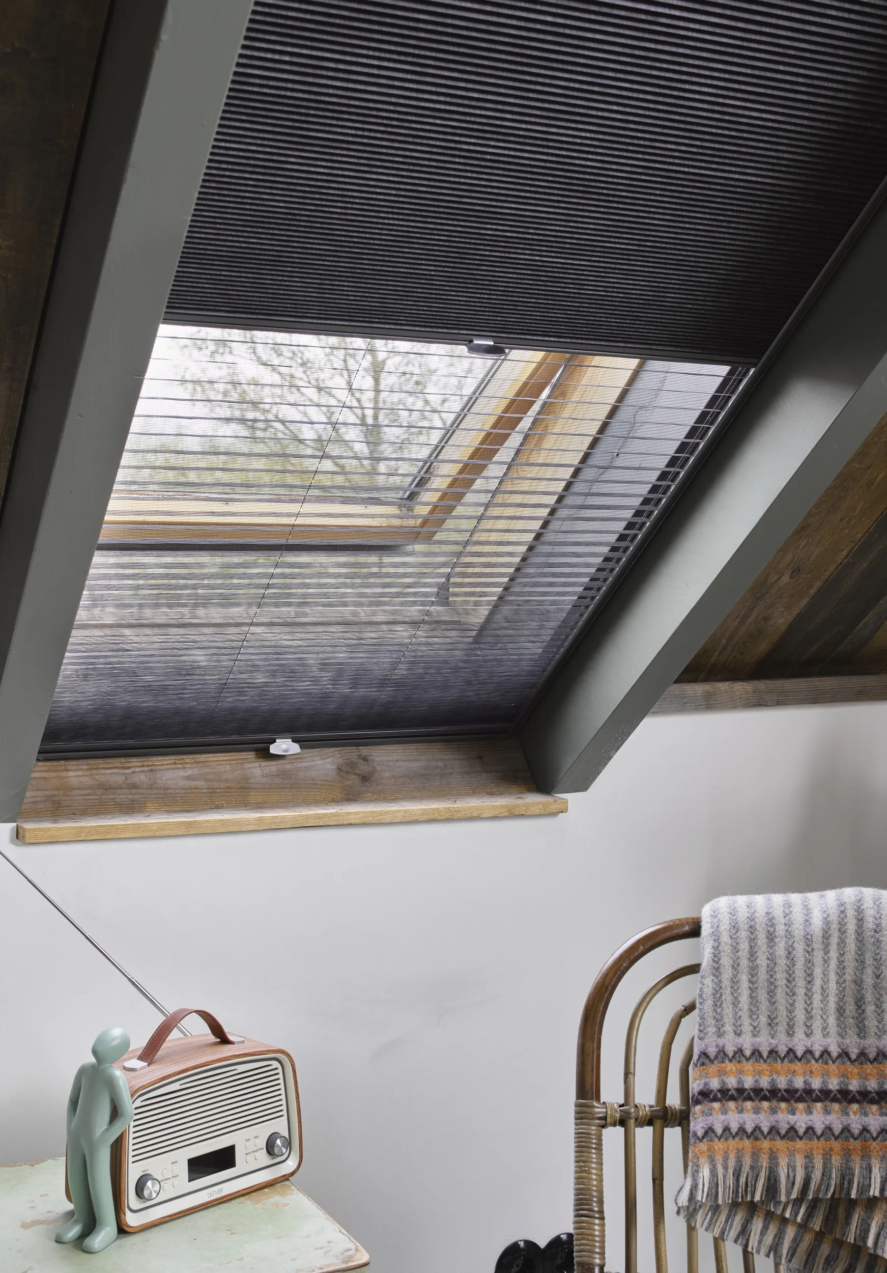 Dark grey duette shades on skylight windows