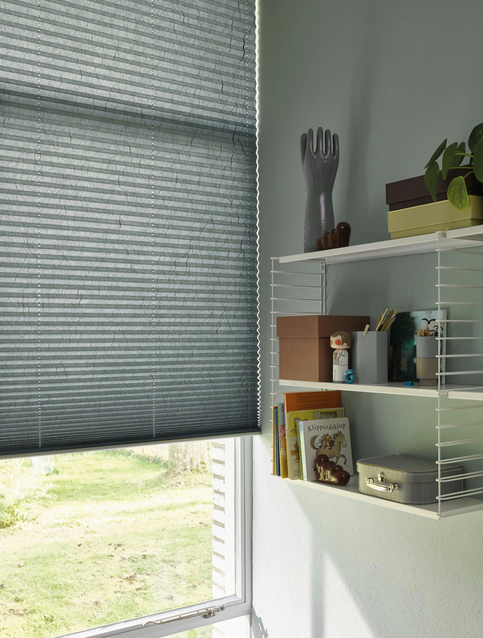 Grey plisse shades in a kids bedroom