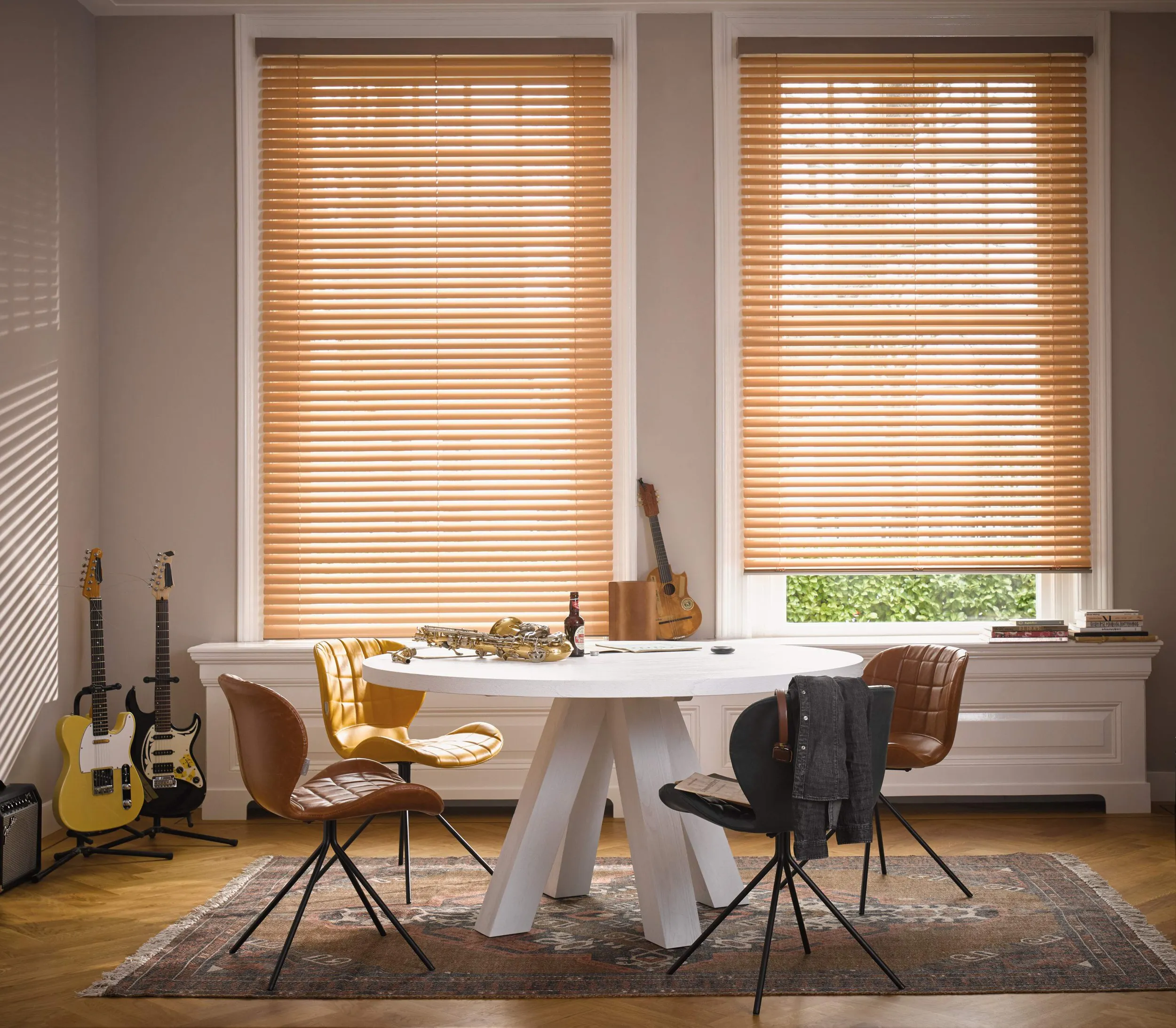 Bright dining room with orange venetian blinds on windows