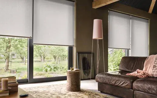 White roller blinds in a modern living room