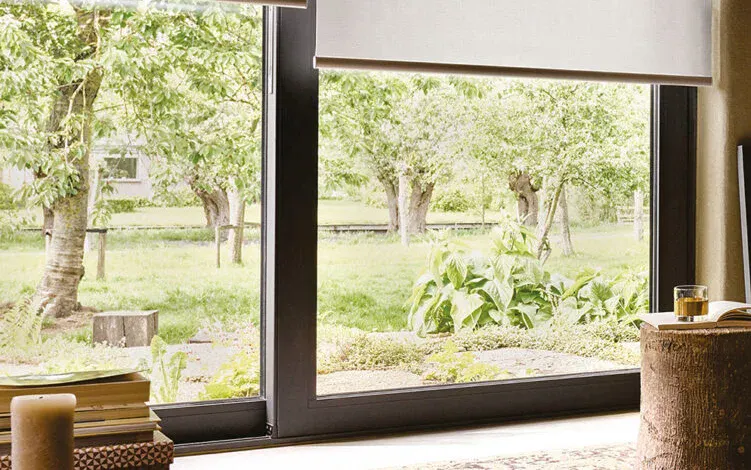 Open cream roller blinds on a window