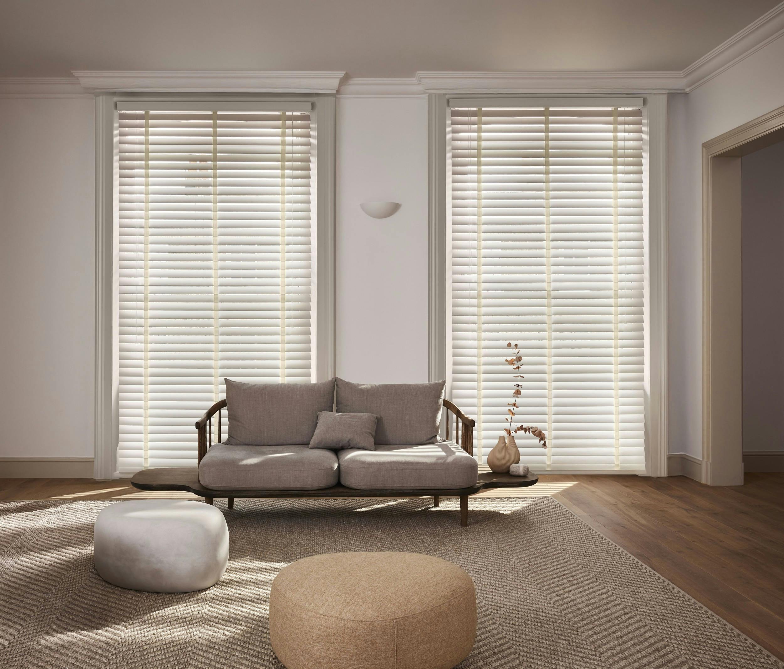 Cream venetian blinds with cream woven tapes in a modern living room 