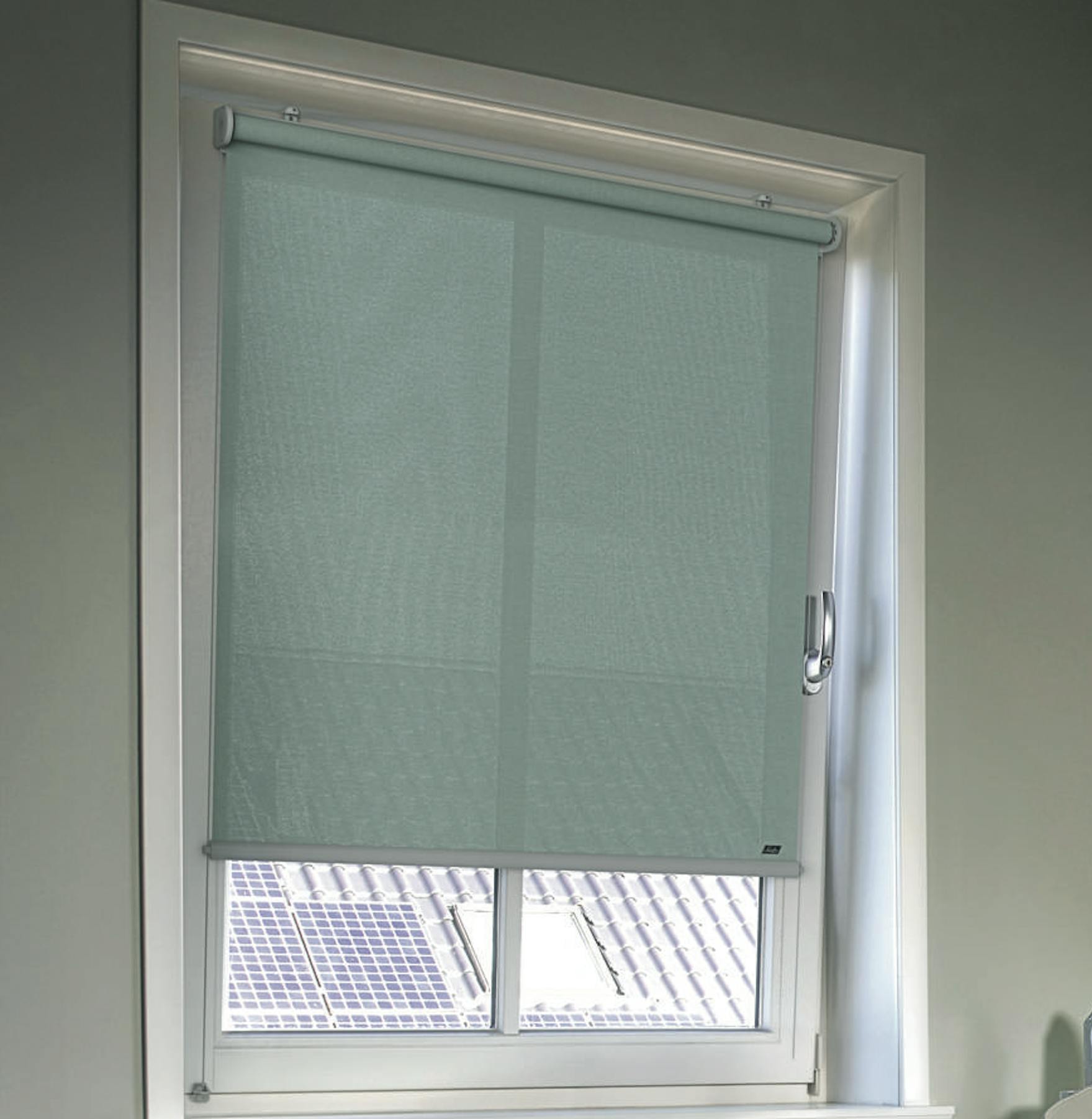 Cosy home office with light teal roller blinds on windows