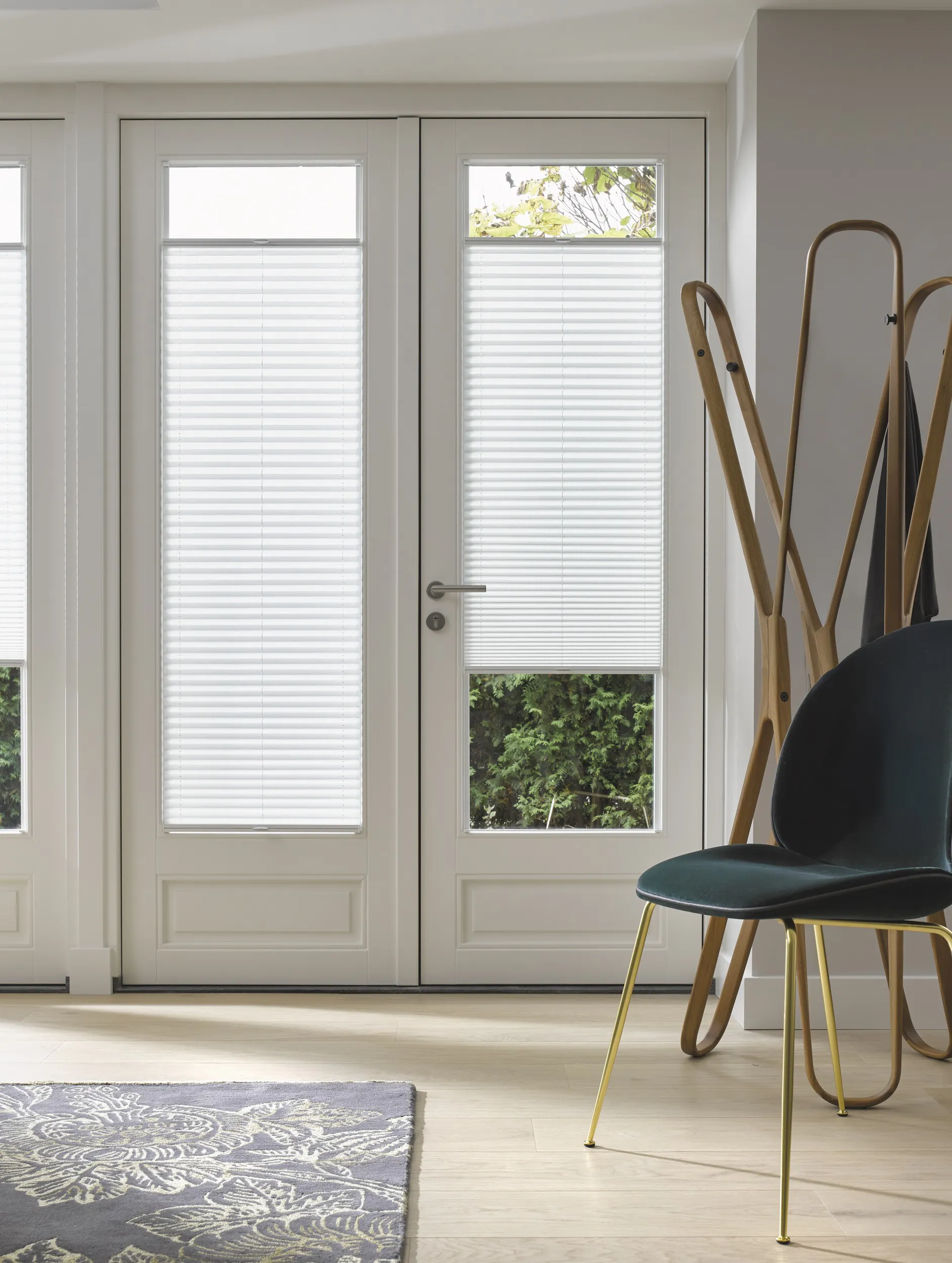 White plisse shades on patio doors 