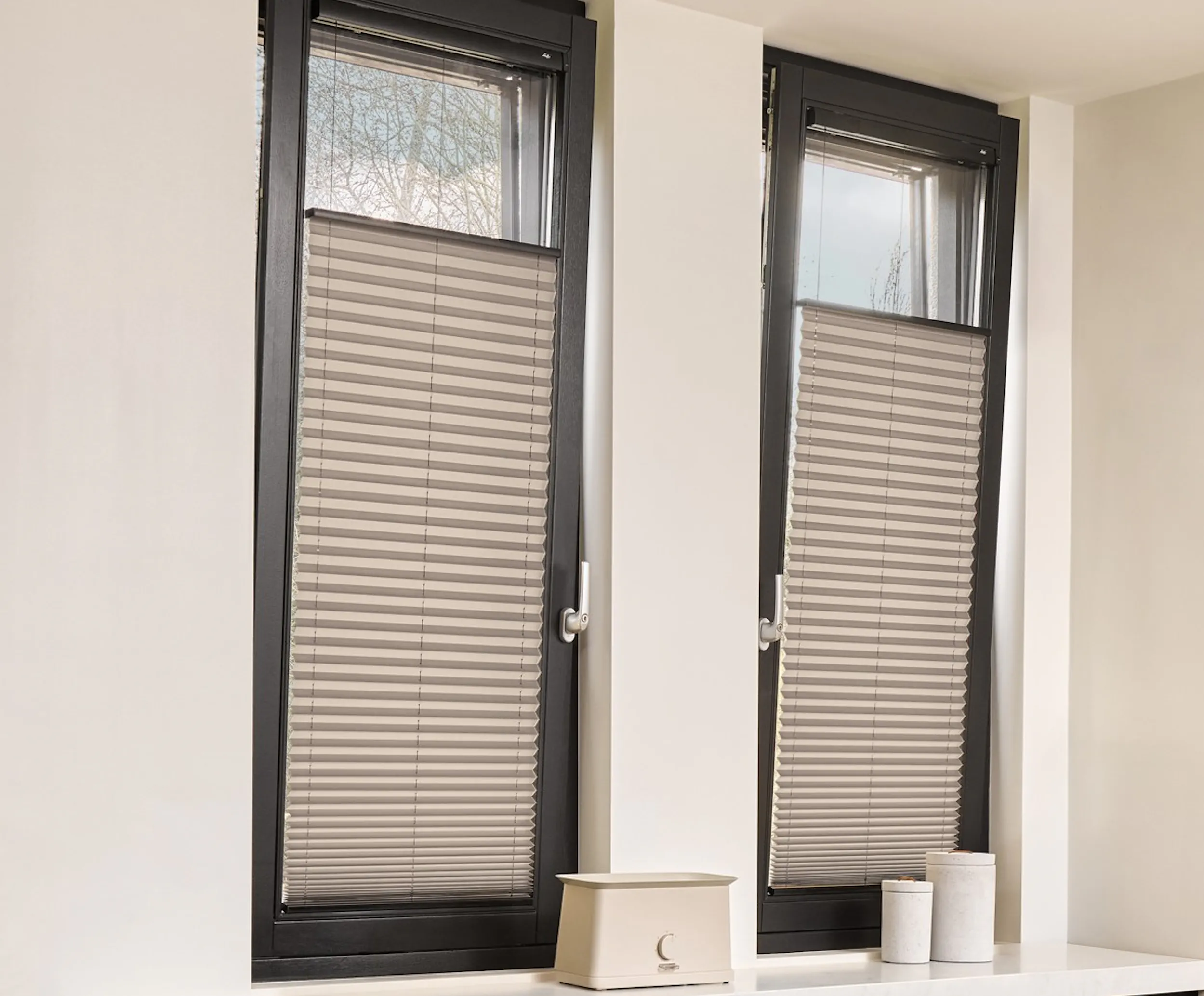 Grey plisse shades on door and windows in a kitchen
