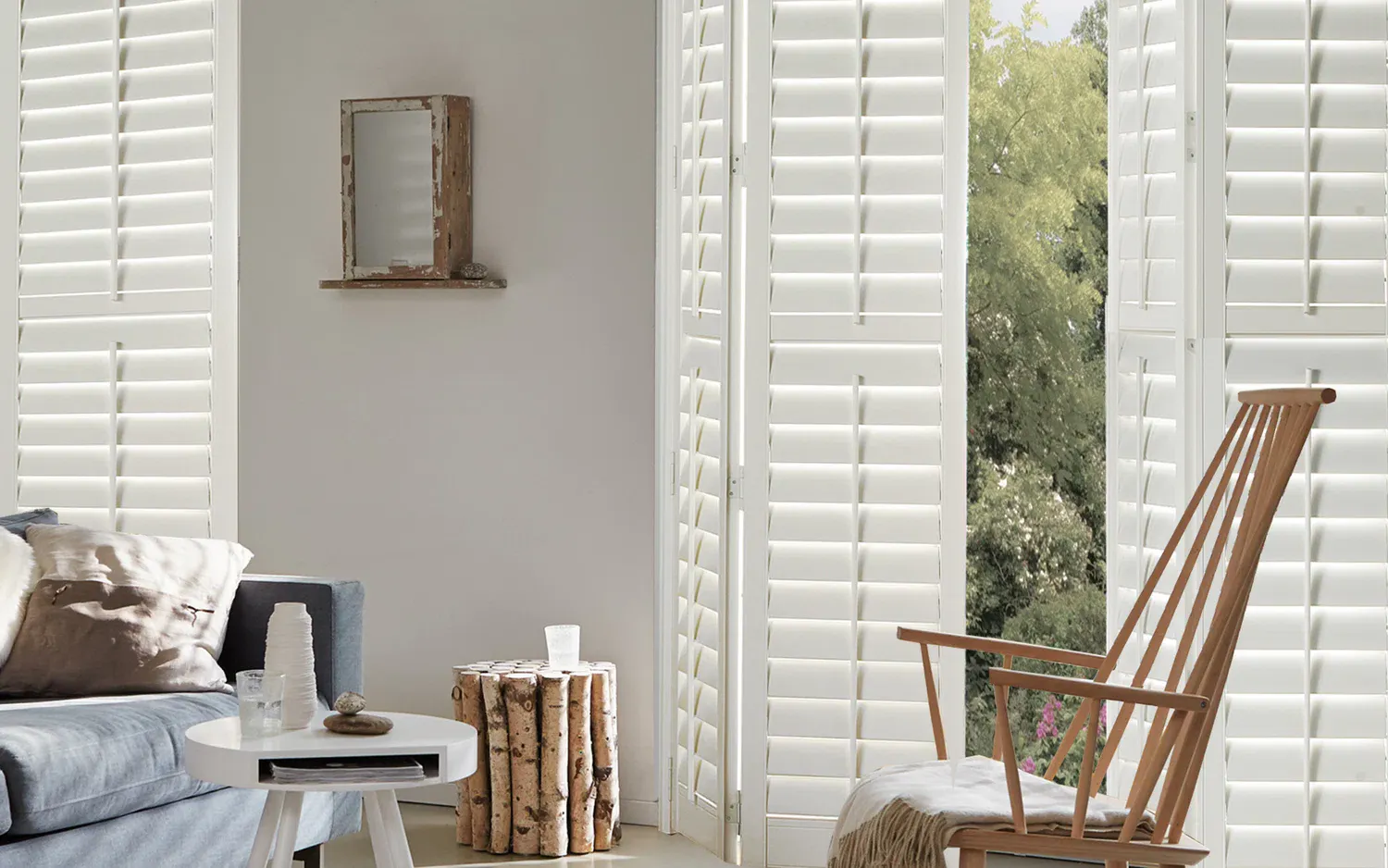 White full-height shutters in a living room