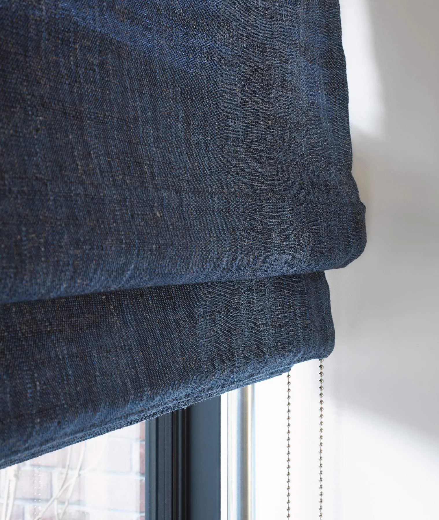 Closeup of blue roman blinds