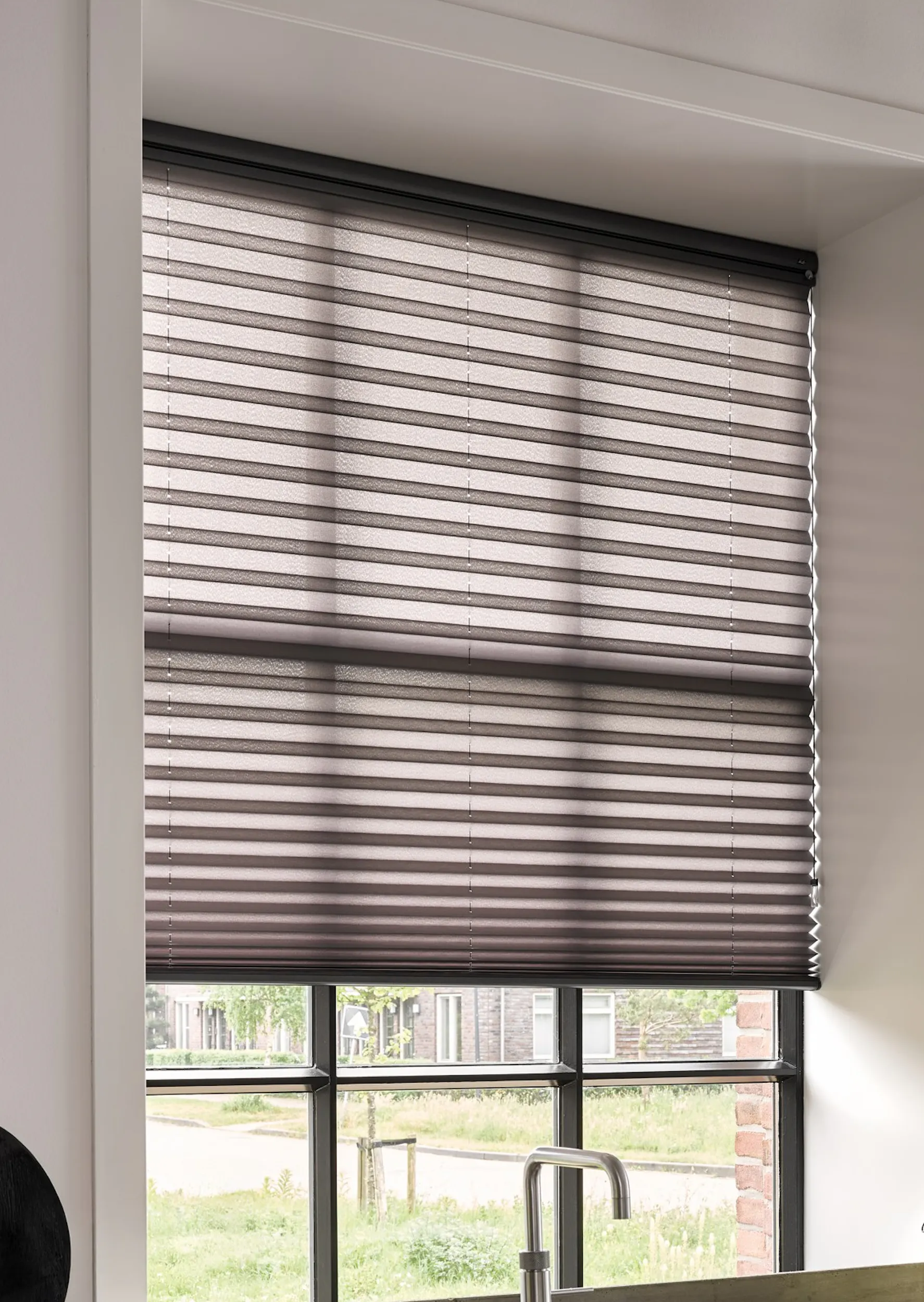 Black plisse shades on a kitchen window