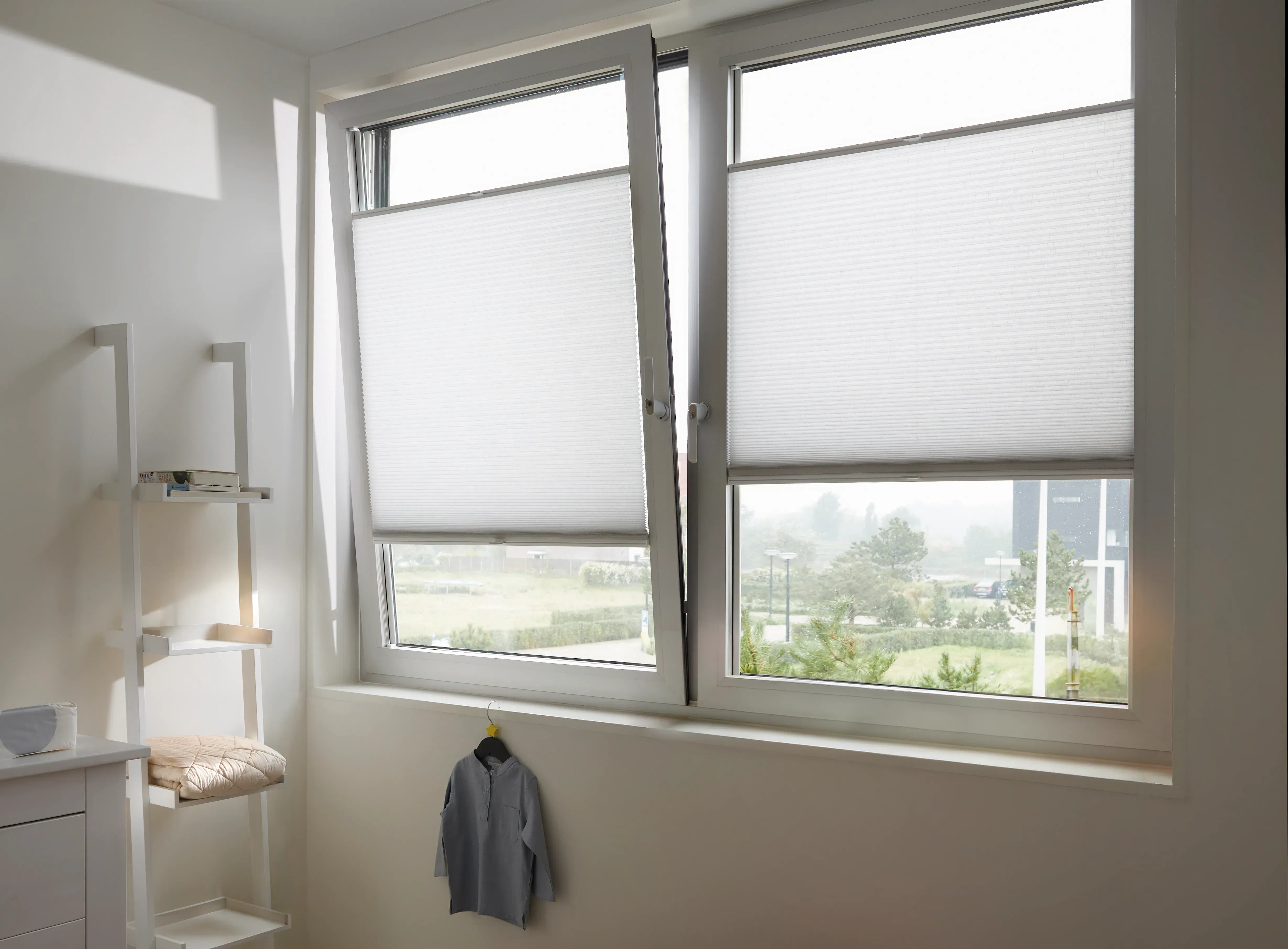 White honeycomb blinds on tilt and turn windows in a bathroom