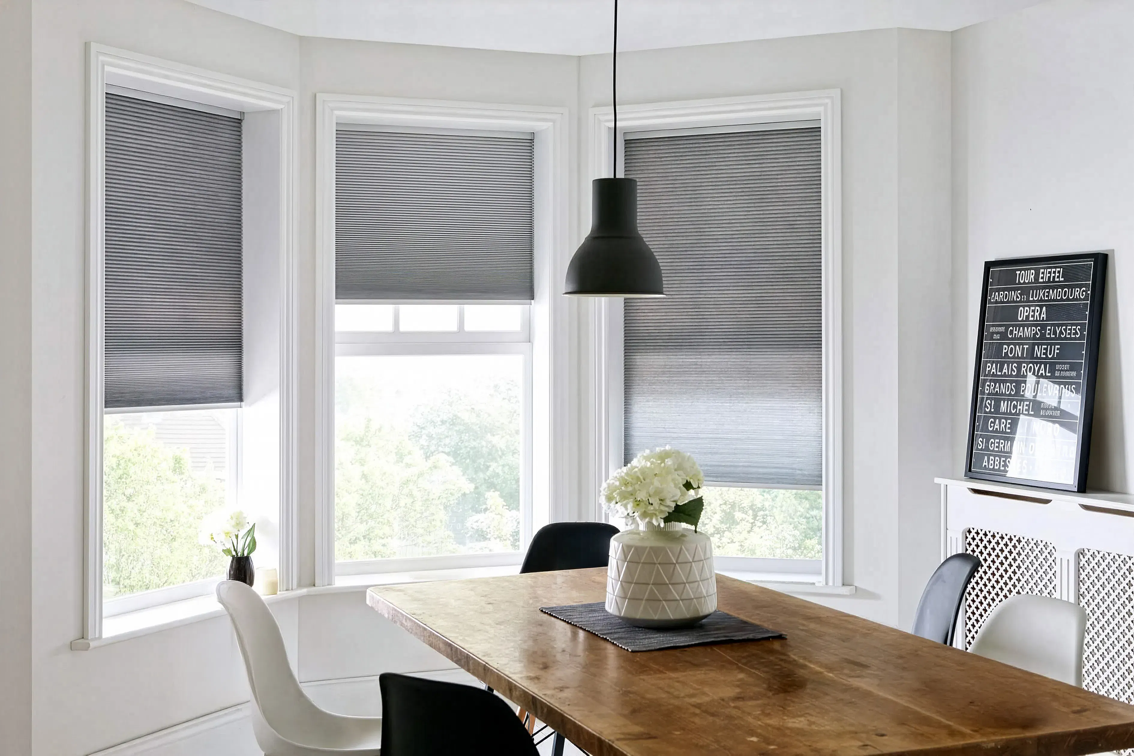 Grey honeycomb blinds in a dining room