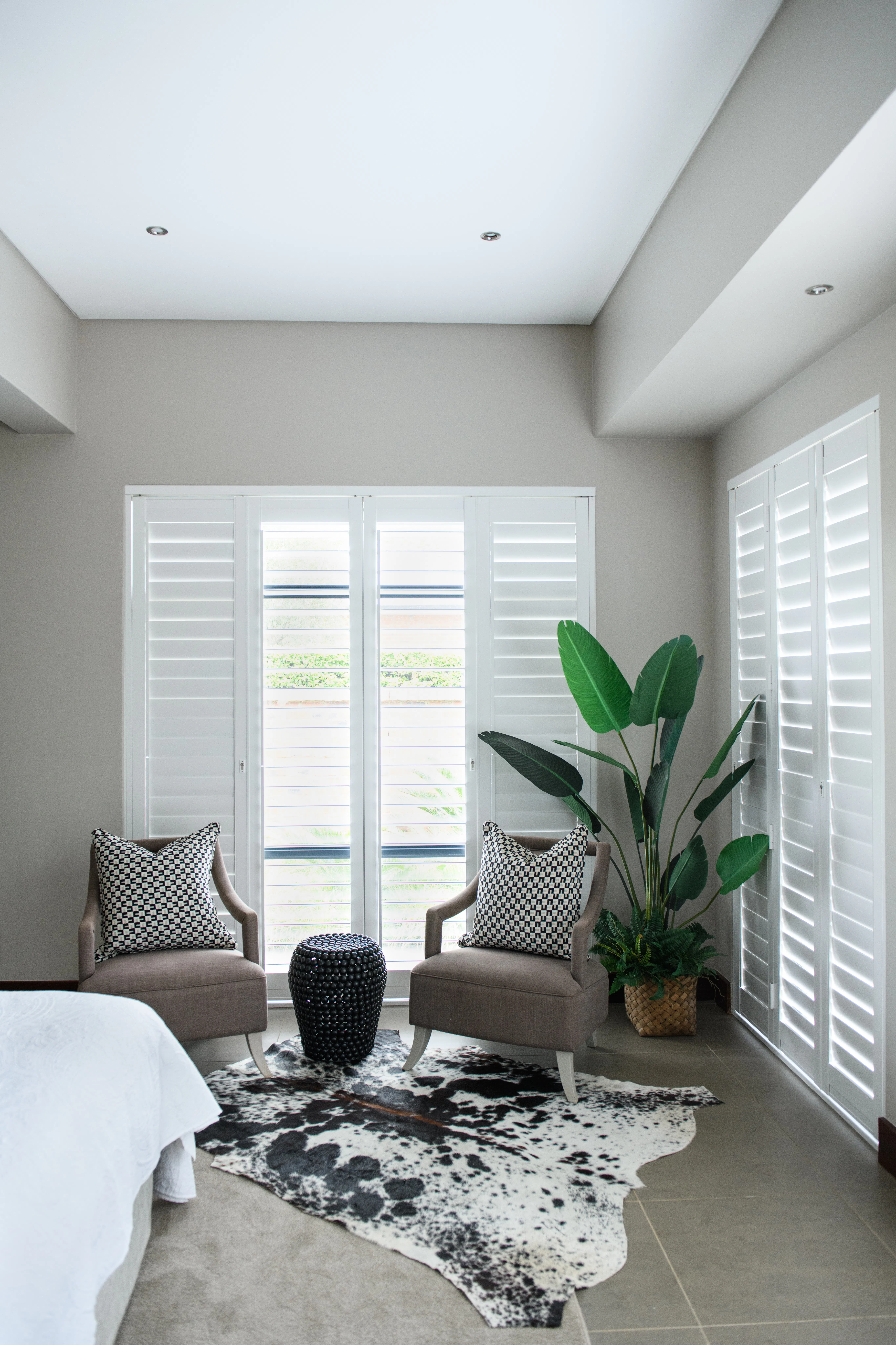 White shutters in a South African bedroom