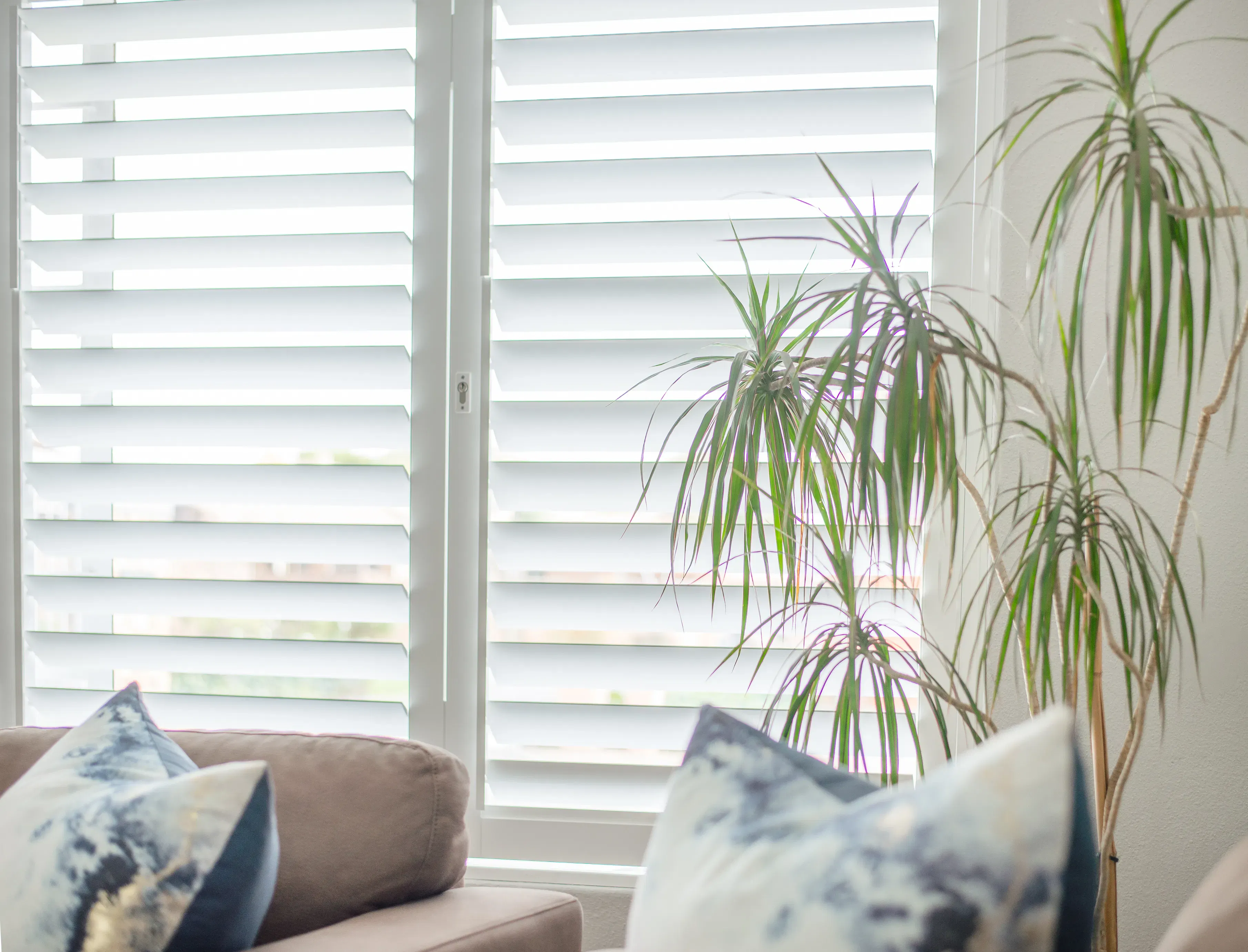 ShutterX white bifold shutter in a living room