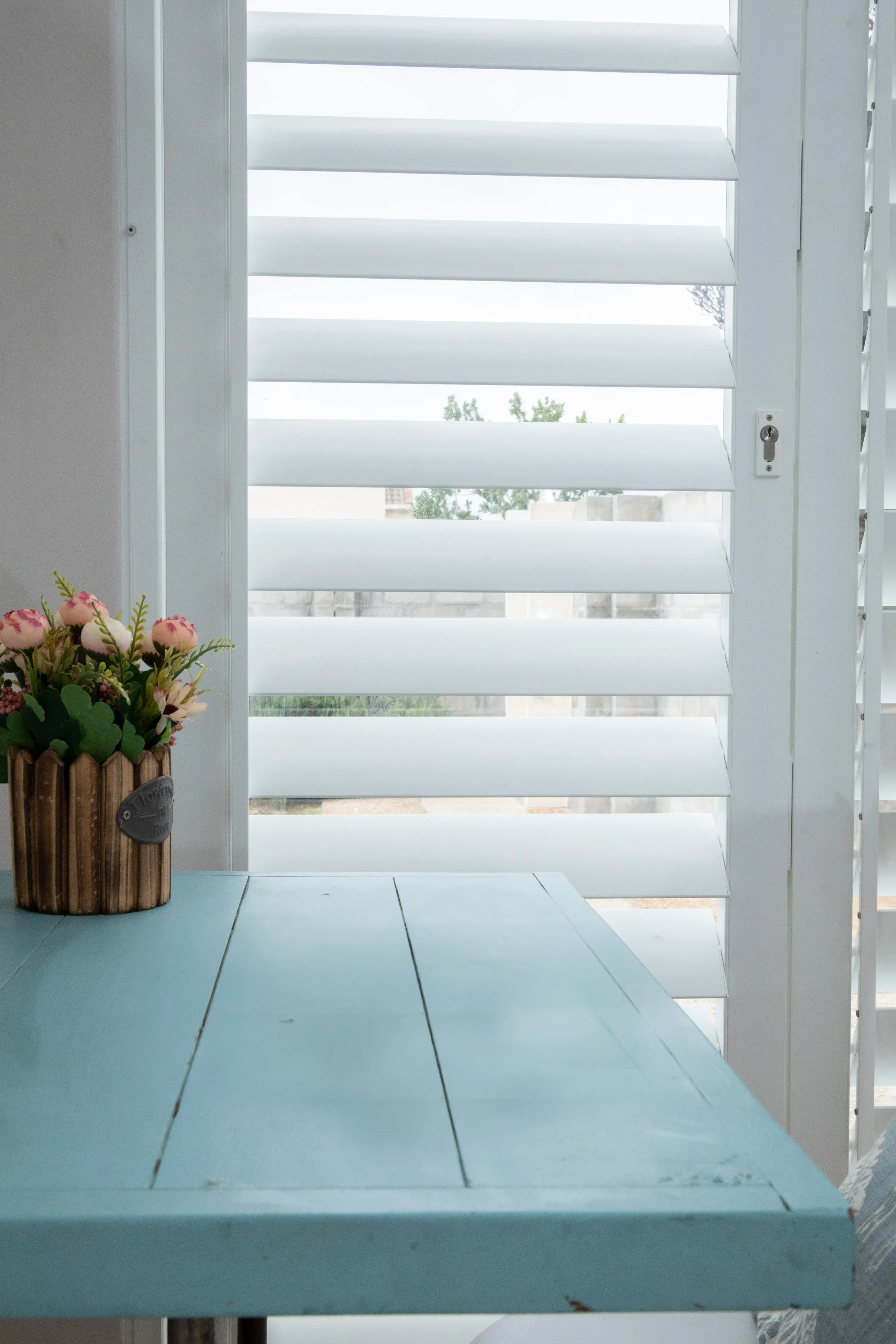 Closeup of a ShutterX white shutter