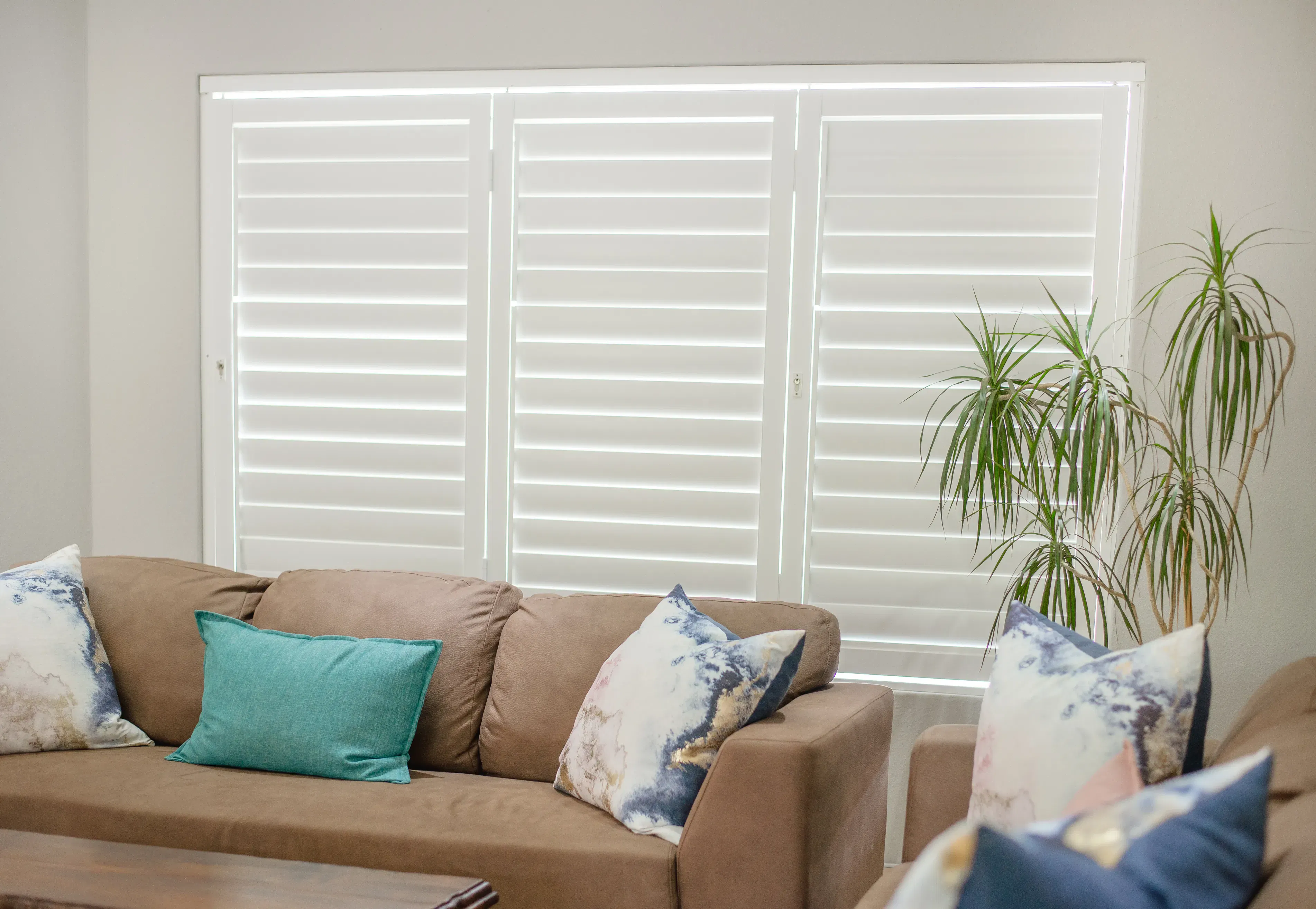 ShutterX white bifold shutter in a living room