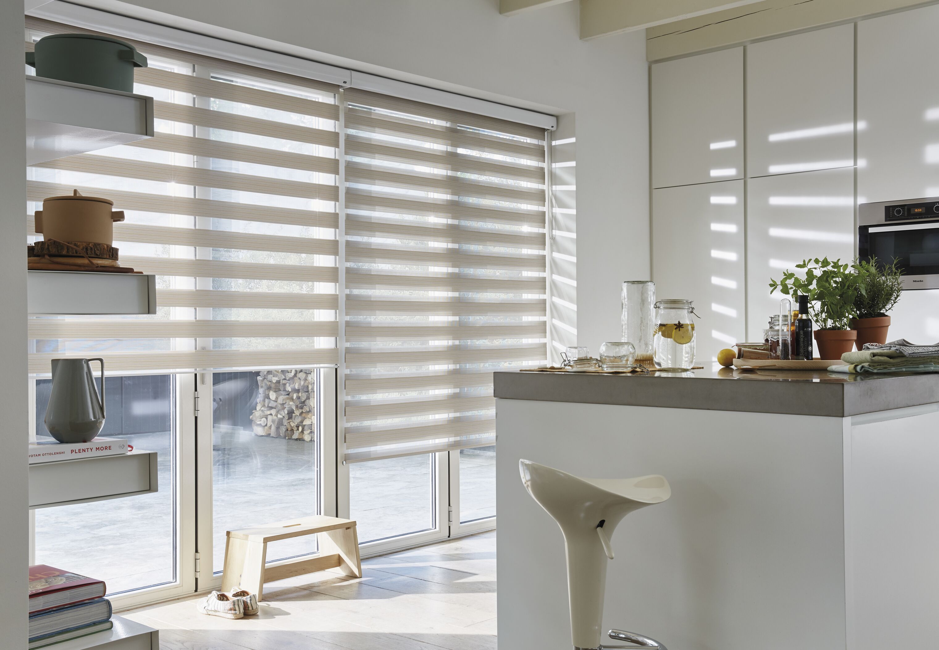 Cream duo roller blinds in a kitchen