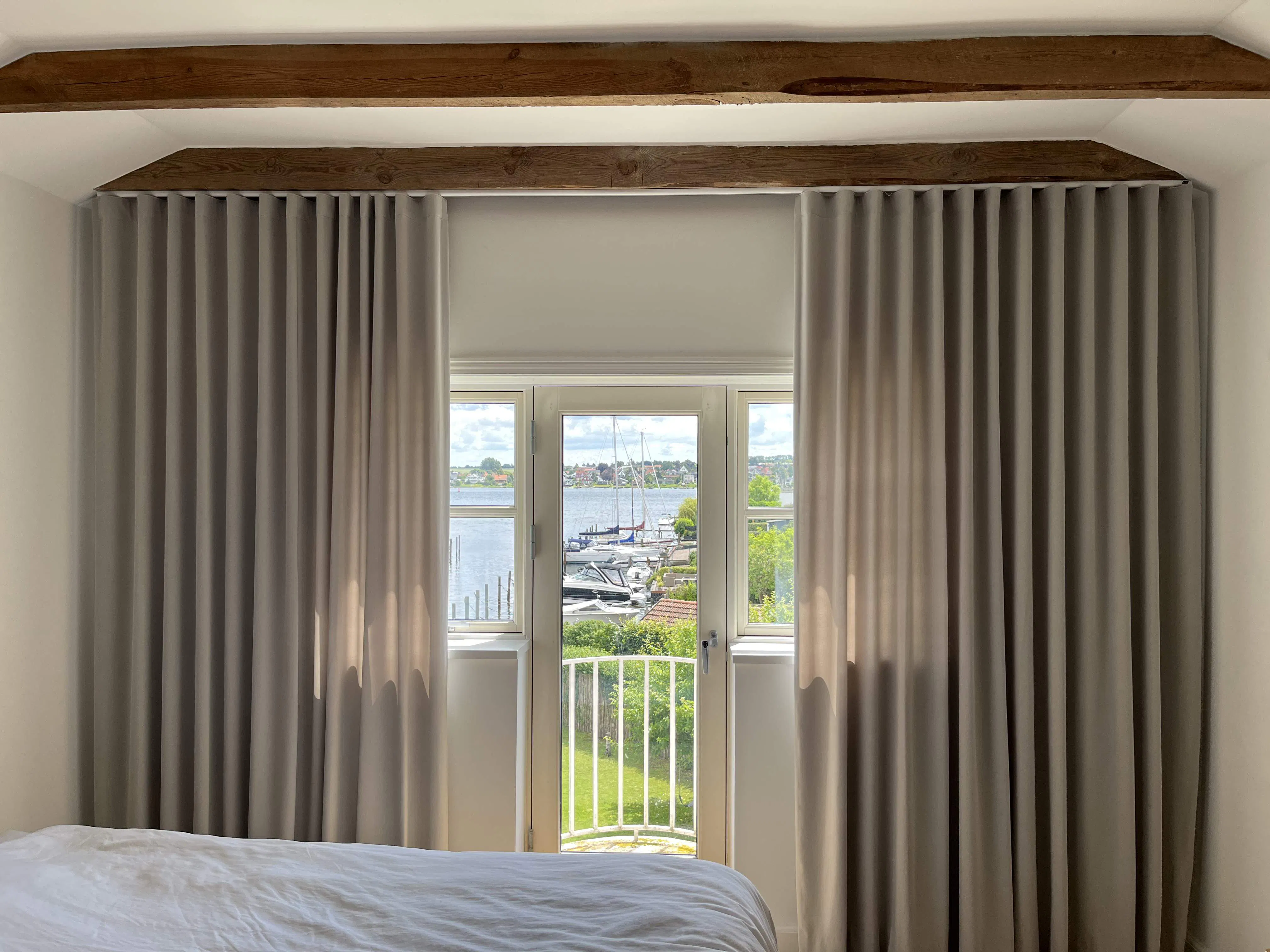 Beige curtains in a bedroom