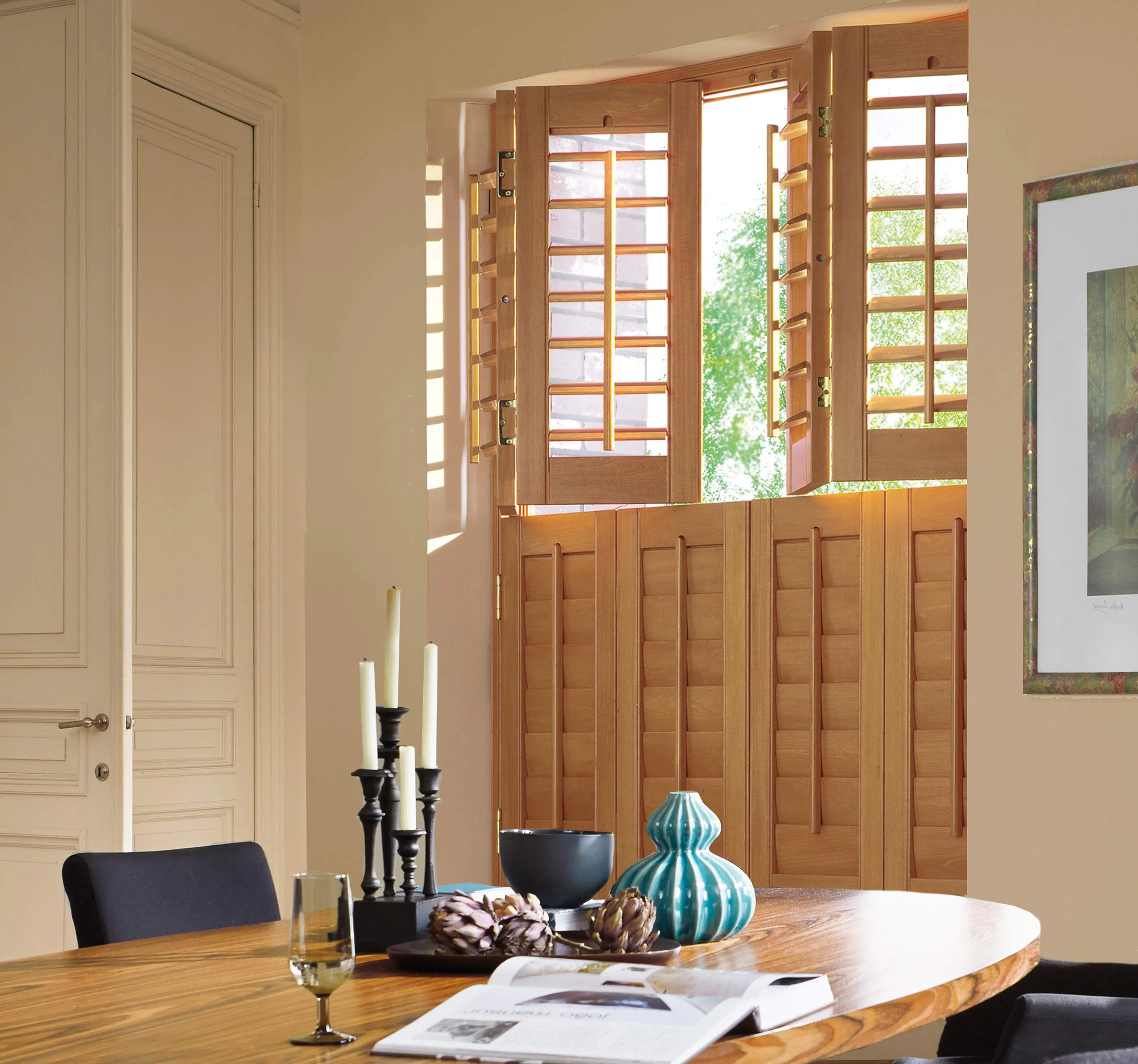 Brown tier on tier shutters in a dining room
