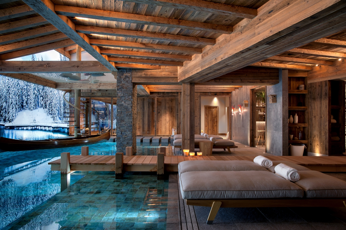 Nicky Dobree designed spa area in winter chalet style with wooden beams and jettee. Daybeds situated beside the pool area.